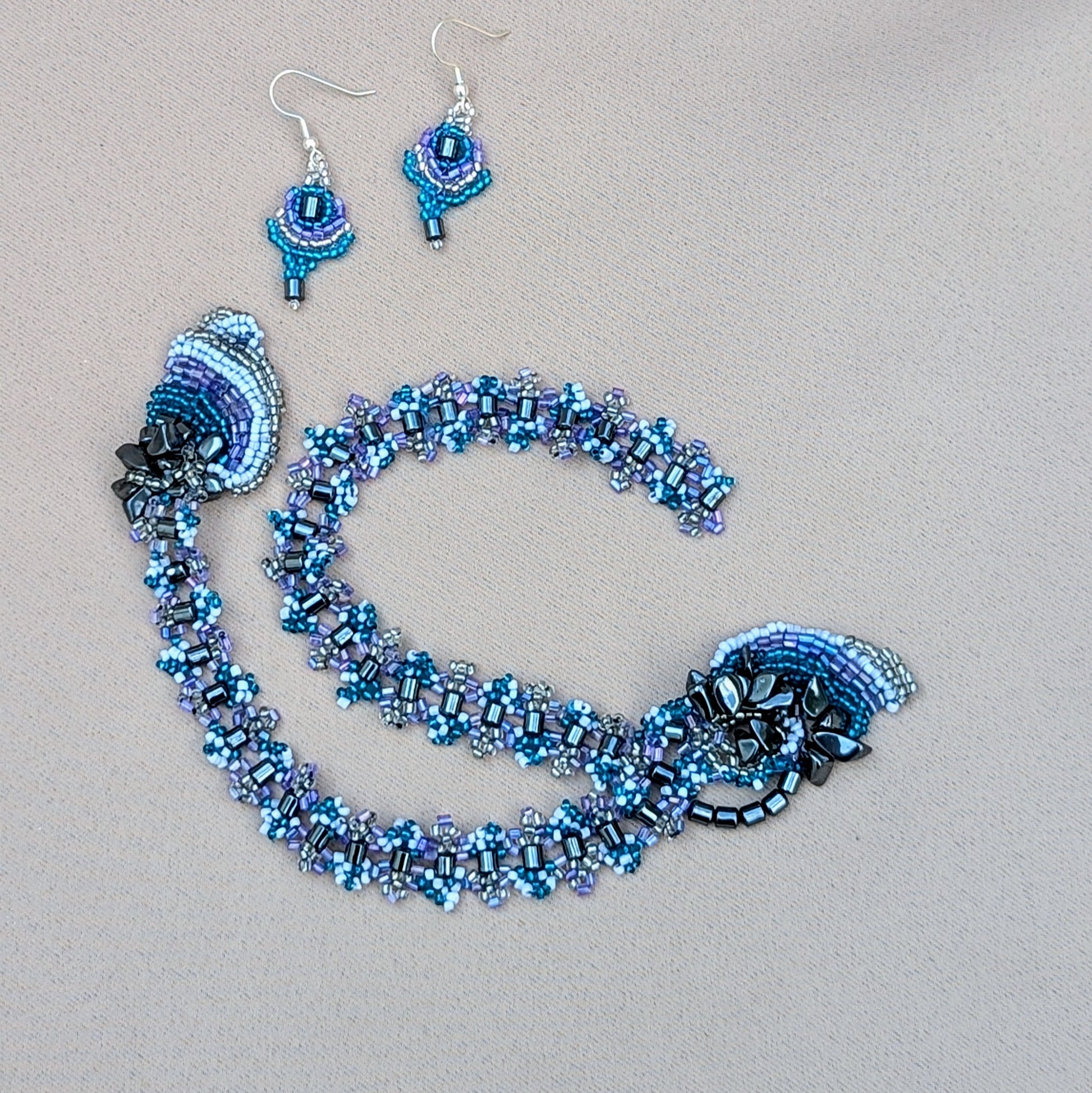 Matching lilac and hematite earrings paired with upcycled beaded necklace handmade by Mayaani Jewellery.