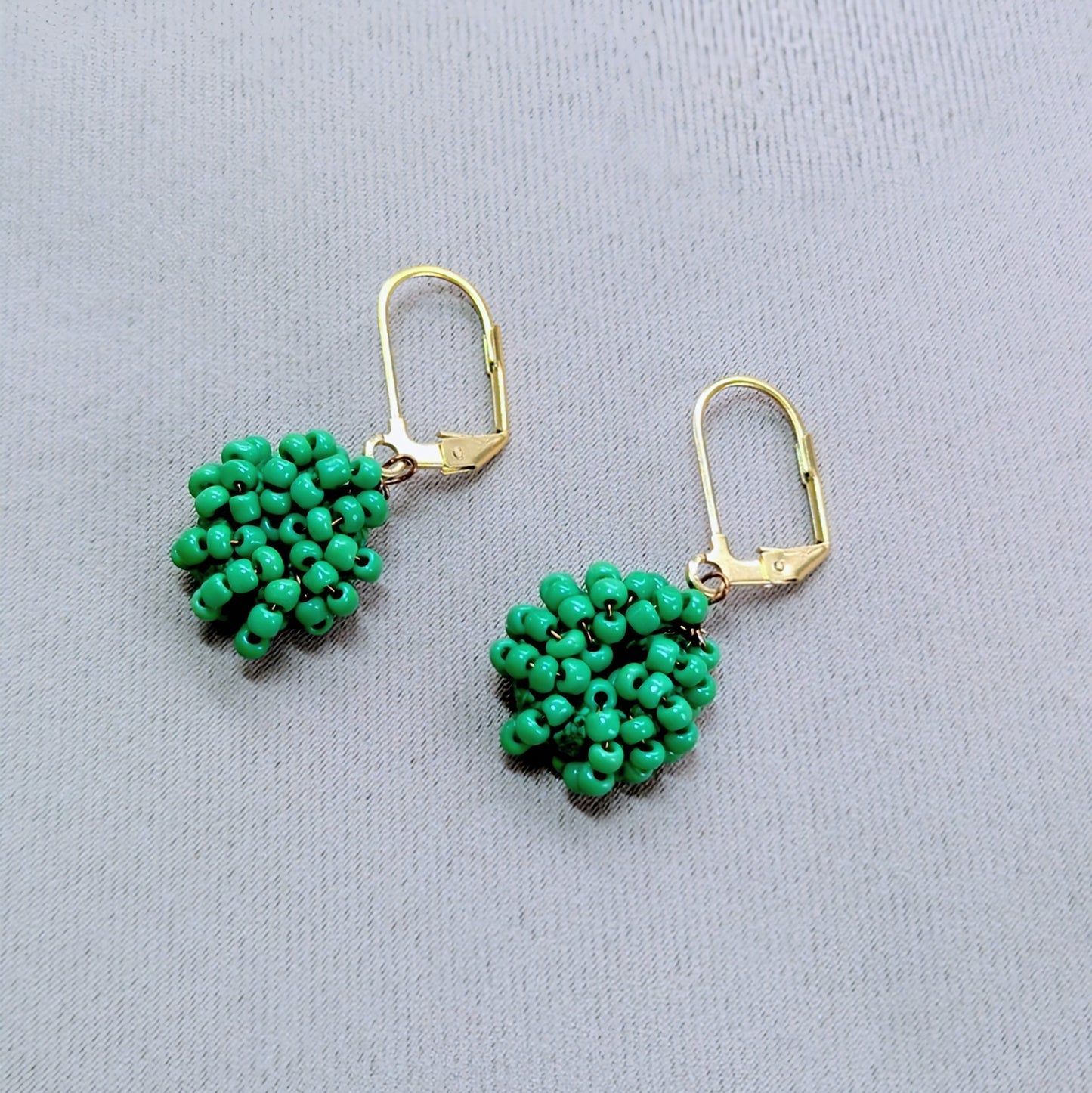 Masi Light Green handmade earrings featuring bronze wire and Egyptian cotton.