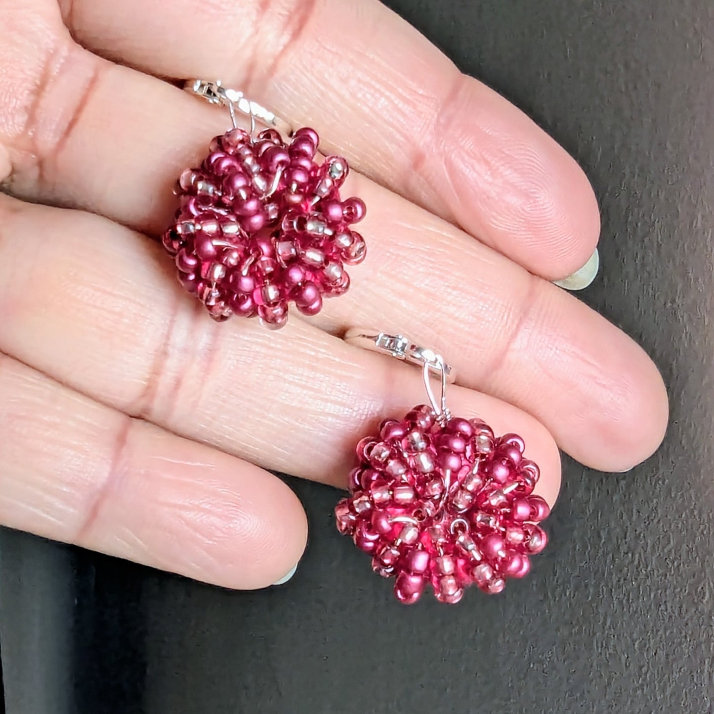 Handwoven berry pink seed bead earrings with sterling silver hooks, handmade in the UK.