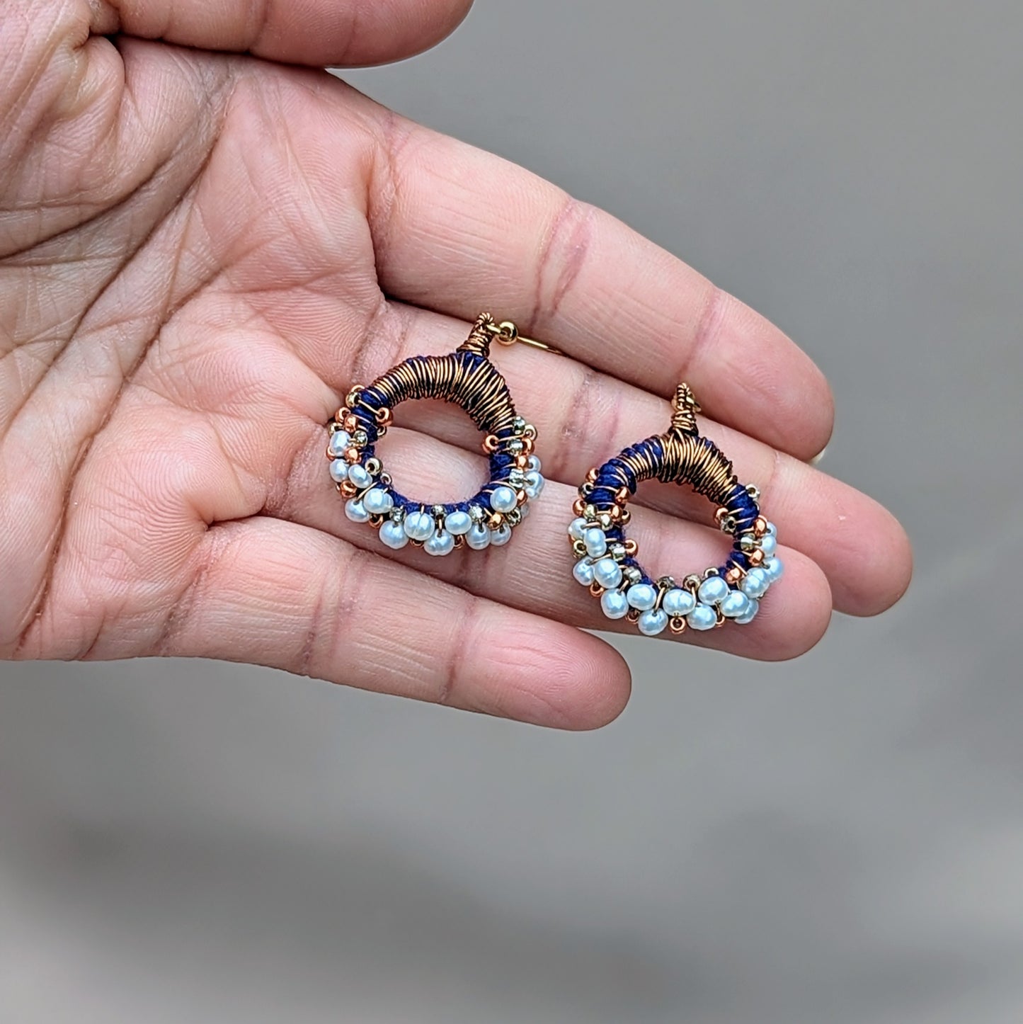 Timeless hoop earrings crafted with freshwater pearls, Japanese Miyuki seed beads, and copper tones, eco-friendly and hypoallergenic.