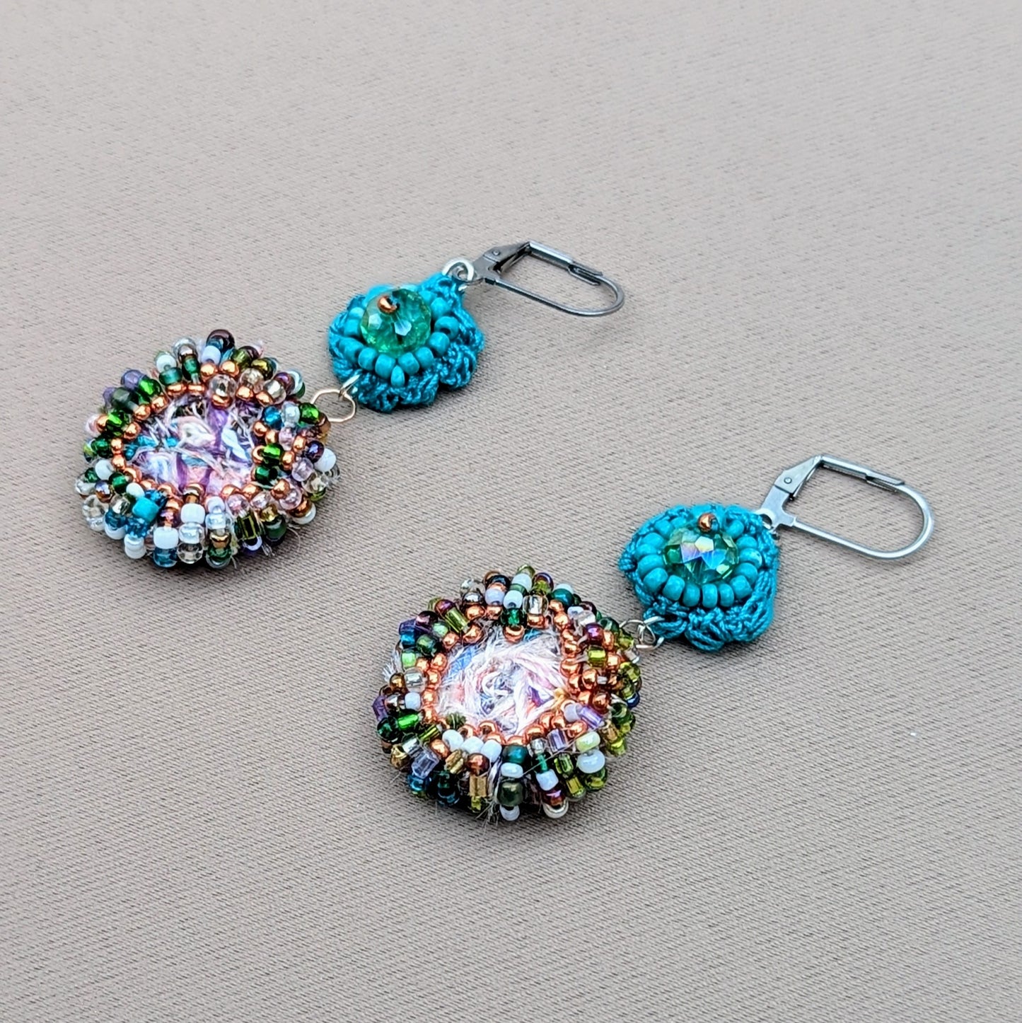 A pair of artisanal Indian fusion turquoise scrap bead earrings featuring high quality upcycled seed beads, upcycled Swarovski style bicone bead and Mayaani Jewellery UK's signature scrap bead. Sustainable jewellery for the modern woman.