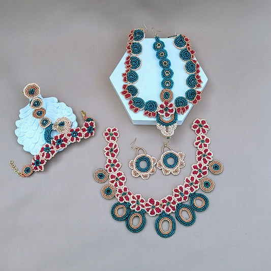 Handmade Neha Indian bridal set in red, emerald green, peach and gold featuring beadwork, crochet and wire wrapping, exclusive to Mayaani Jewellery UK.