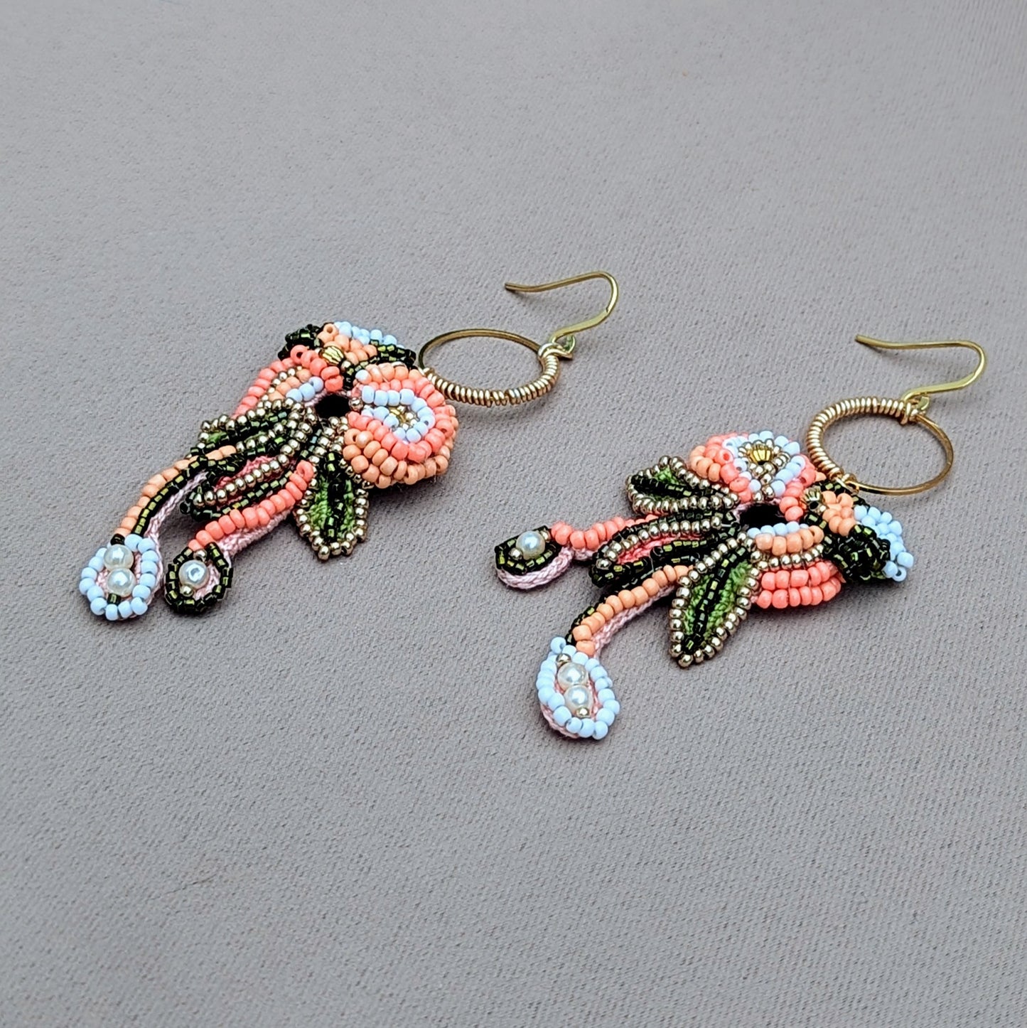 Padmika peach green and gold Indian earrings inspired by heritage colours, handcrafted statement jewellery suitable for weddings and celebrations.
