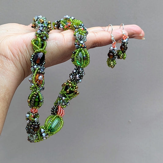 Sustainable glass bead necklace handmade by artisan Megha with matching earrings included.