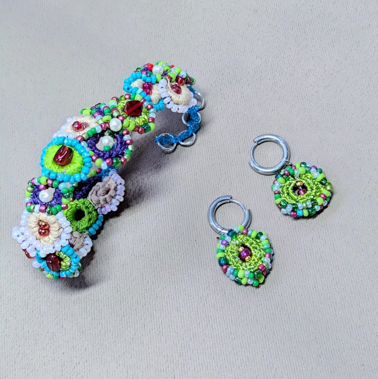 Handcrafted bead crochet bracelet with vintage glass beads and seed pearls, Vana Journey design inspired by a blooming garden.