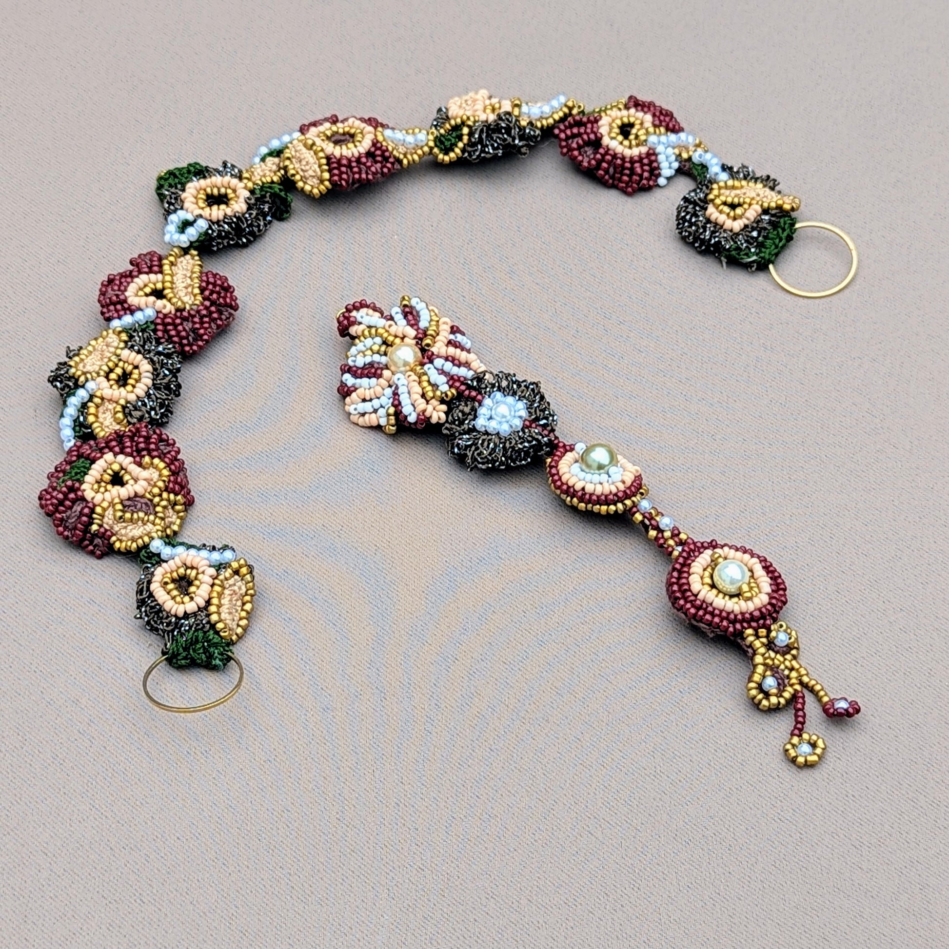 Flat lay image showcasing the headband and maang tikka which connect to form the Aishwarya Indian couture bridal wedding occasion headpiece.