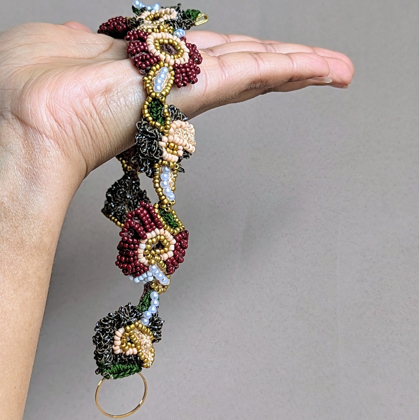 Experience the beauty of a handcrafted Indian bridal headpiece from Mayaani Jewellery, a sustainable UK brand. This stunning accessory features intricate hand-crochet, elegant hand-beading, and skillful hand wire-wrapping. Its innovative design allows it to be worn as both a headband and tikka, offering versatile styling options for your special moments and beyond.