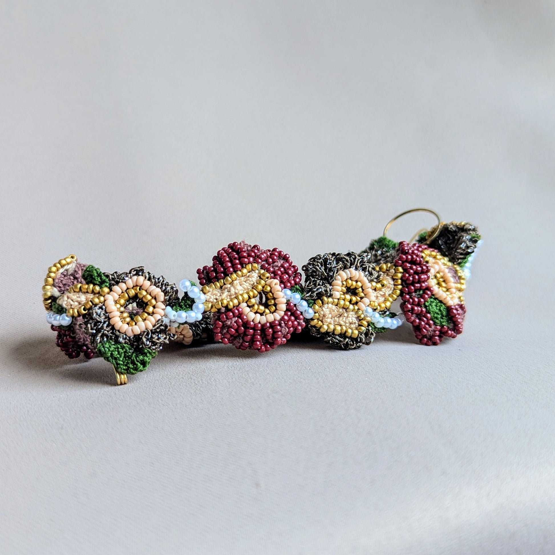 Adorn yourself with a one-of-a-kind Indian bridal headpiece by Mayaani Jewellery, a sustainable brand from the UK. This artisan-crafted piece boasts intricate hand-crochet, exquisite hand-beading, and careful hand wire-wrapping techniques. Its adaptable design can be worn as a headband or tikka, ensuring you have multiple styling options for future occasions.