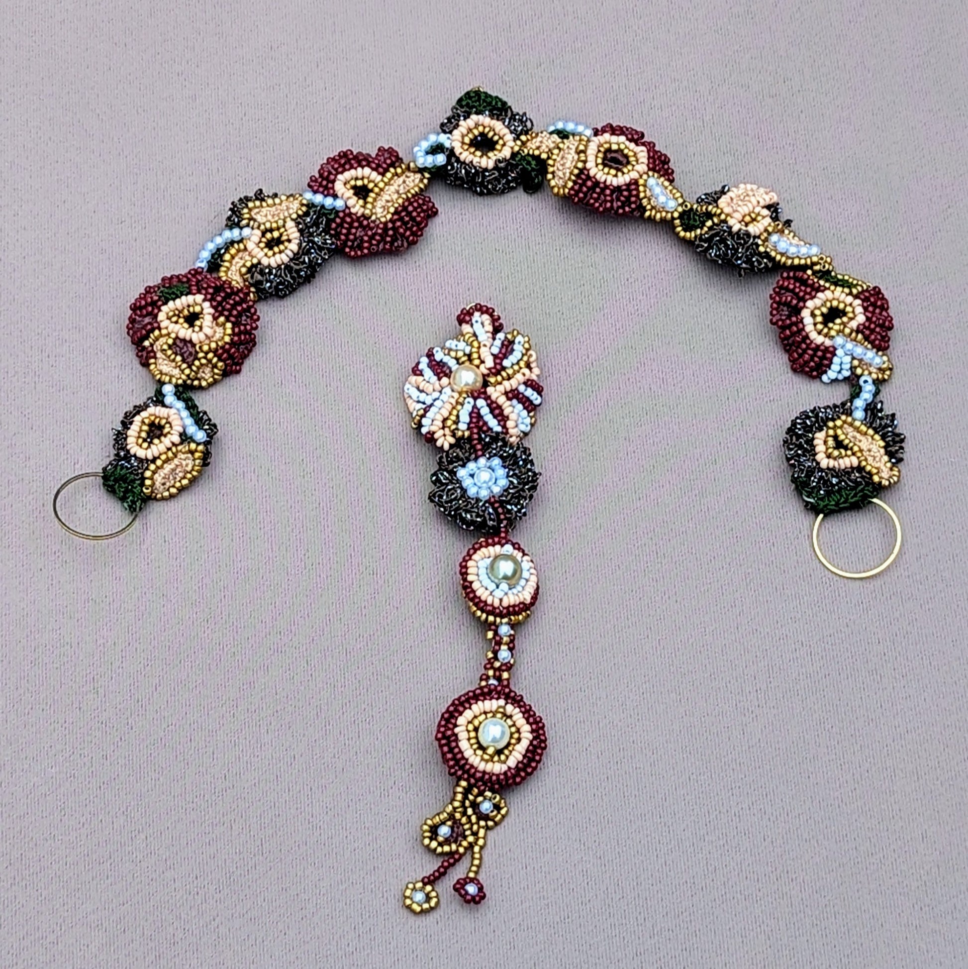 Introducing a beautifully handcrafted Indian bridal headpiece from the sustainable UK brand Mayaani Jewellery. This unique creation features detailed hand-crochet, elegant hand-beading, and intricate hand wire-wrapping. Its clever design lets you style it as a headband or tikka, providing multiple ways to wear it for future celebrations.