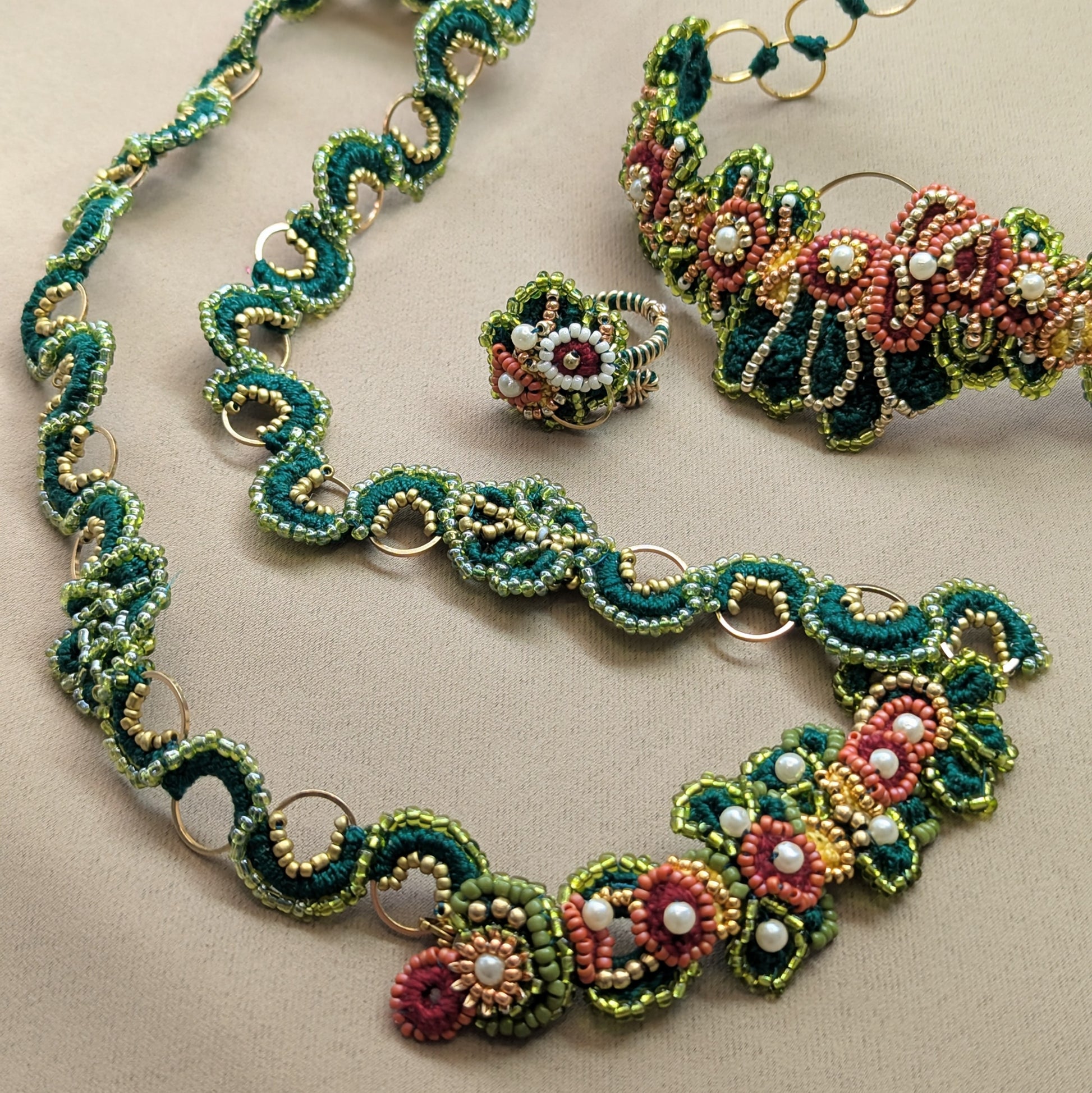 Rukmini full set - handmade Indian hand bracelet with bespoke custom chain by Mayaani Jewellery, teal, green, coral and gold beadwork.