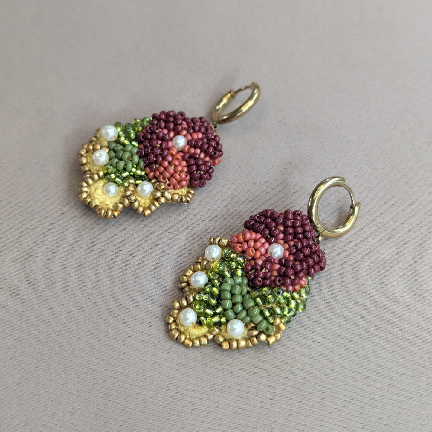 Detail shot of Rukmini beaded drop earrings by Mayaani Jewellery - Czech and Japanese glass seed beads, upcycled pearls and antique bronze copper wire, handmade in the UK.