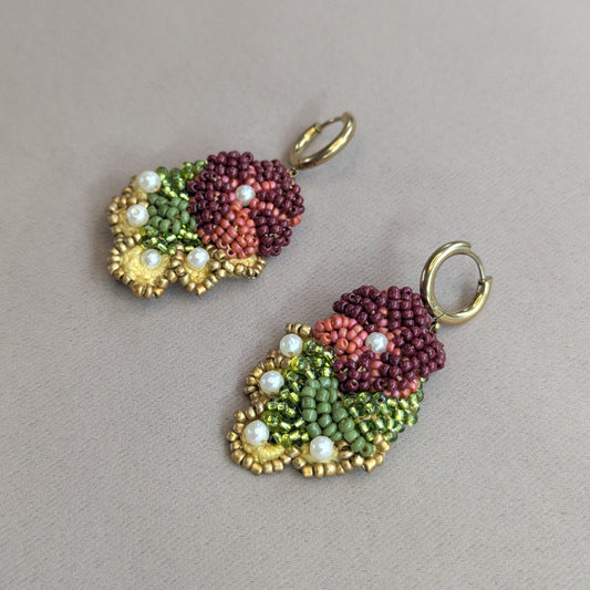 Detail shot of Rukmini beaded drop earrings by Mayaani Jewellery - Czech and Japanese glass seed beads, upcycled pearls and antique bronze copper wire, handmade in the UK.