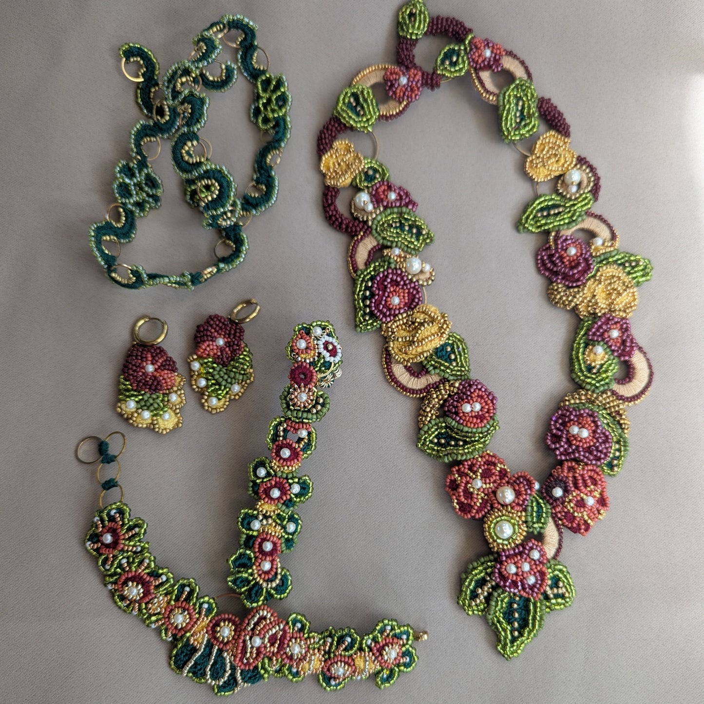 The Rukmini Indian Couture bridal wedding occasion jewellery set handcrafted exclusively for sustainable brand Mayaani Jewellery UK in red, green, gold, yellow and pearl accents featuring several detachable elements to transition effortlessly from occasion to everyday.