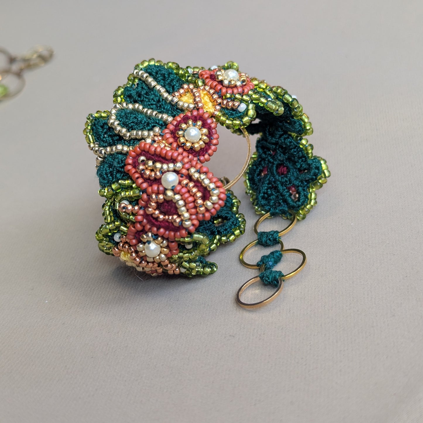 Rukmini pictured as a standalone statement Western style bracelet against a neutral backdrop. Innovative bracelet handmade by Mayaani Jewellery UK.