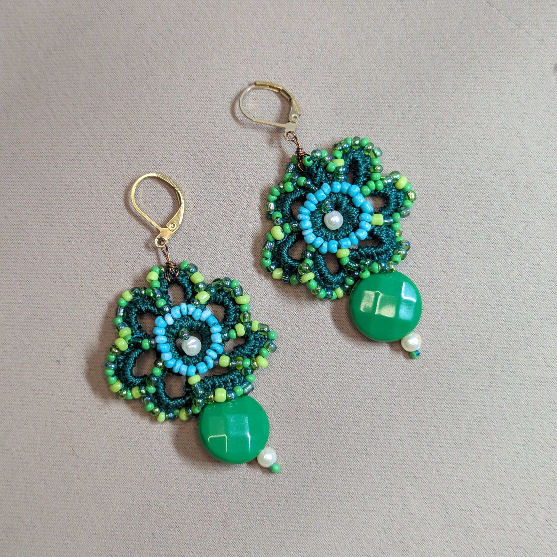 One of a kind green beaded drop earrings with intricate floral crochet design, Czech glass seed beads and gold stainless steel hooks.