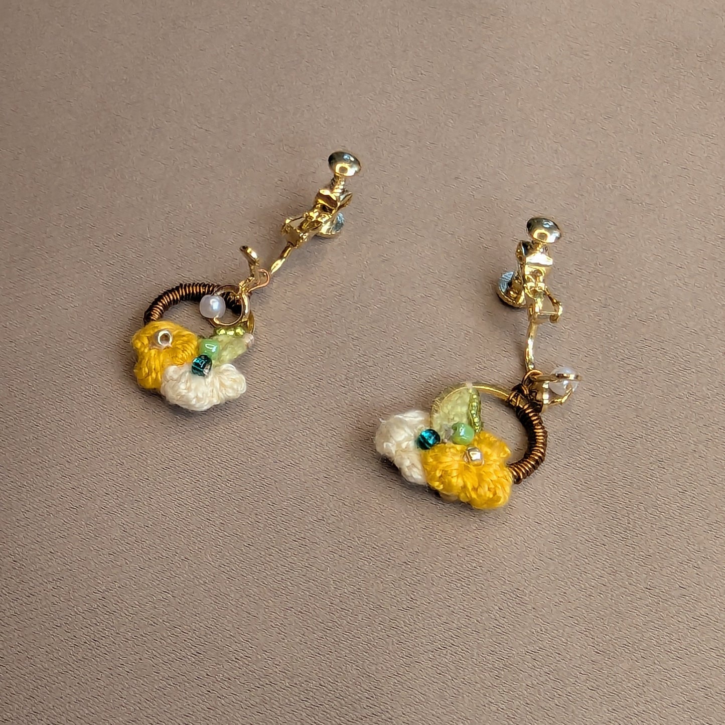 Sustainable handmade clip-on earrings with botanical and floral inspired motifs exclusive to luxury Indian designer brand Mayaani Jewellery UK.