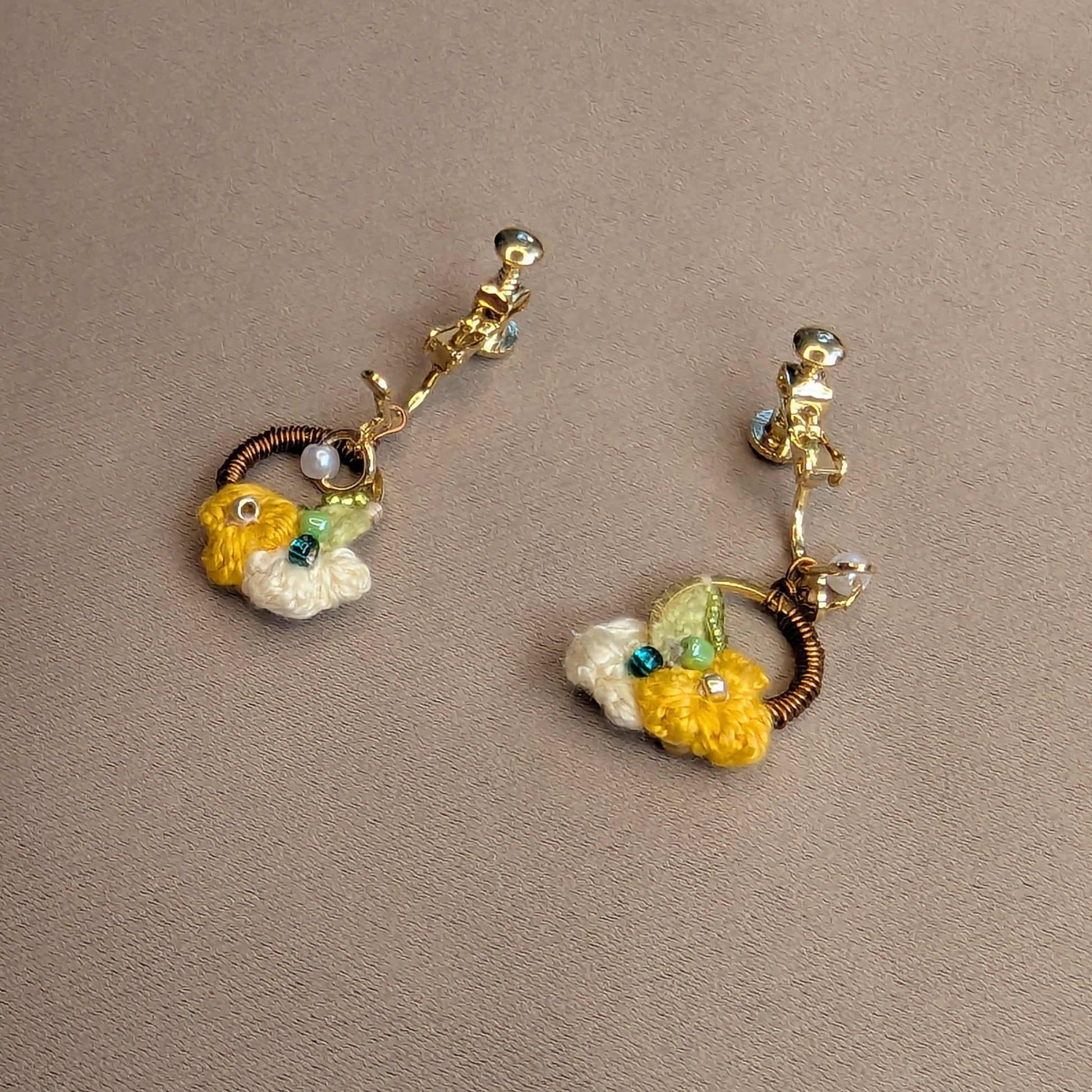Sustainable handmade clip-on earrings with botanical and floral inspired motifs exclusive to luxury Indian designer brand Mayaani Jewellery UK.