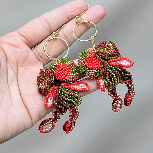 Tamira red green gold statement beaded Indian earrings handcrafted with glass seed beads and gold hoops.