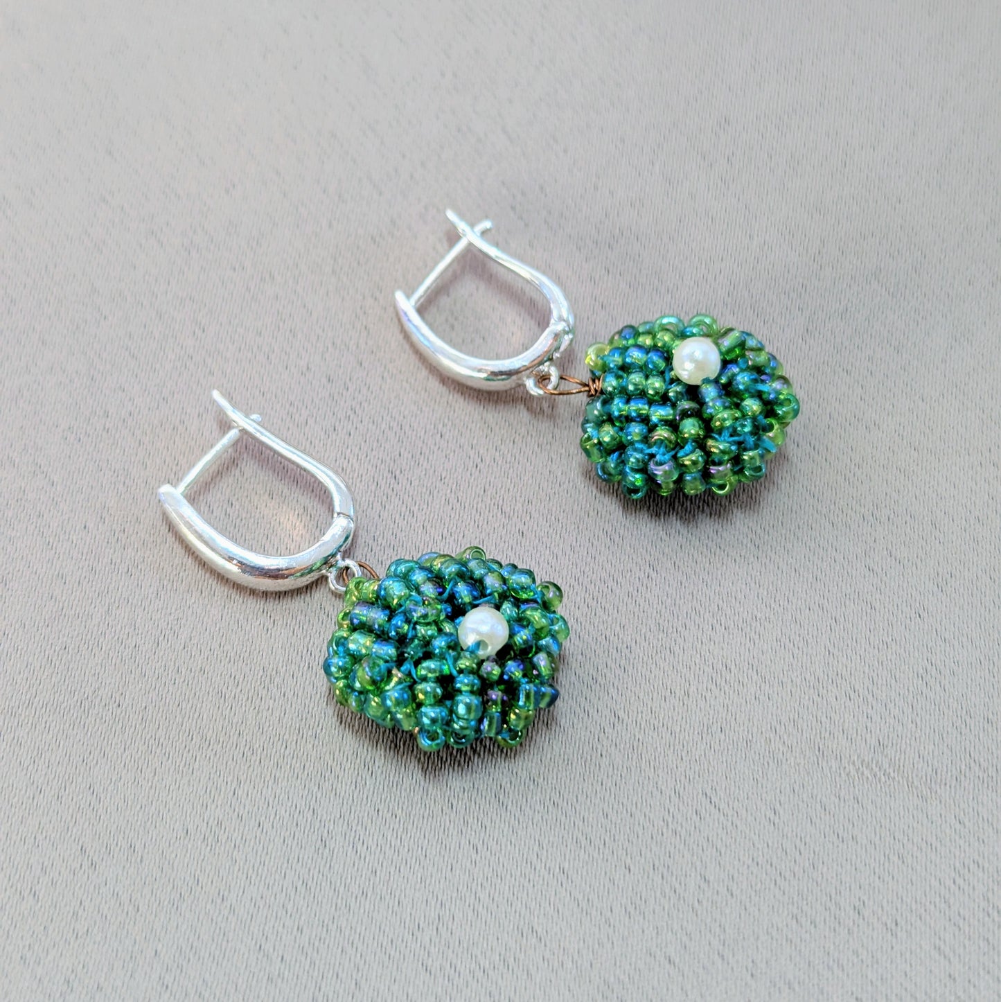 Handmade everyday green pearl earrings crafted by Megha using sustainable materials and traditional techniques.