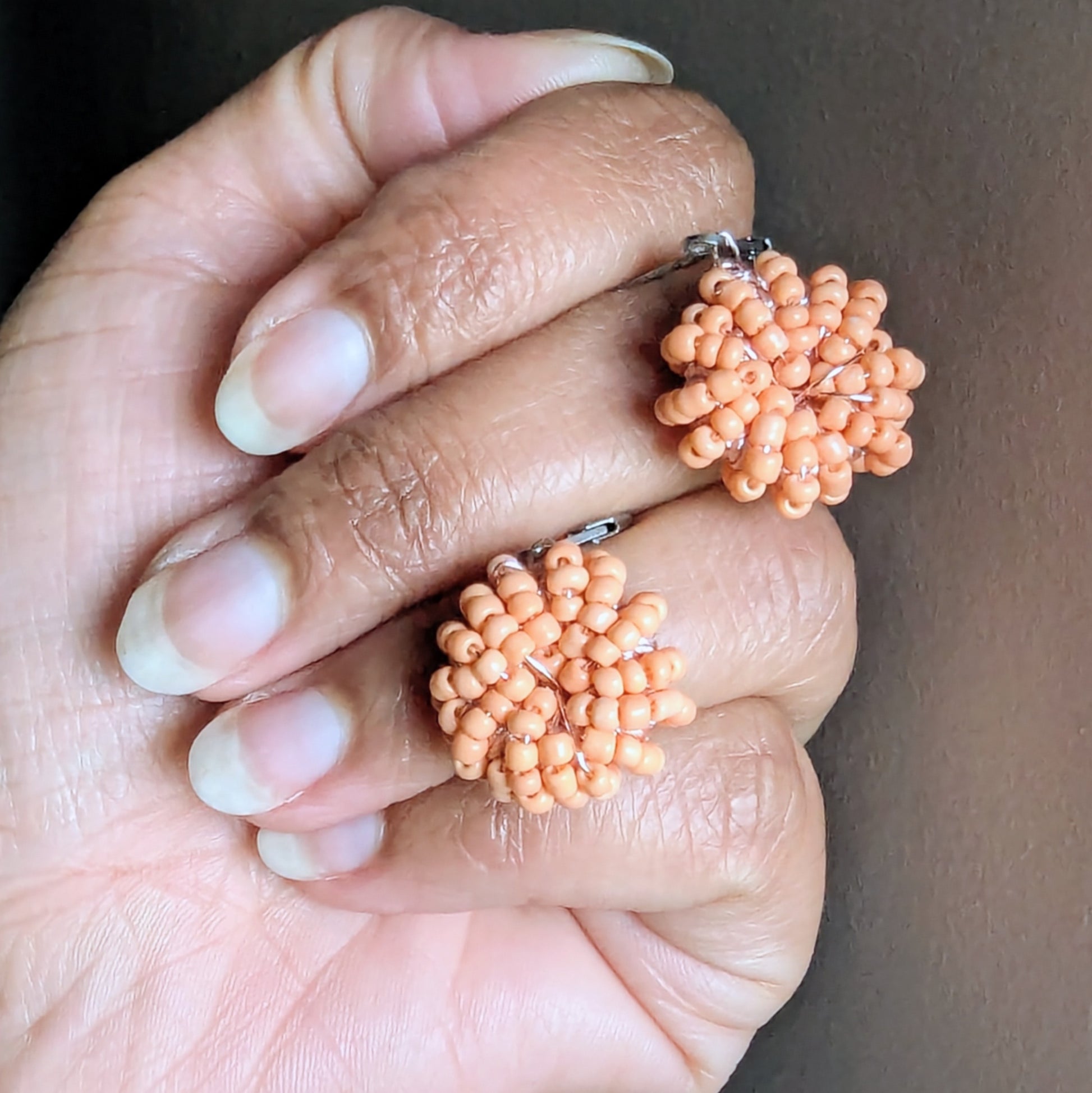 Masi Peach handmade earrings featuring antique bronze wire and Egyptian cotton.