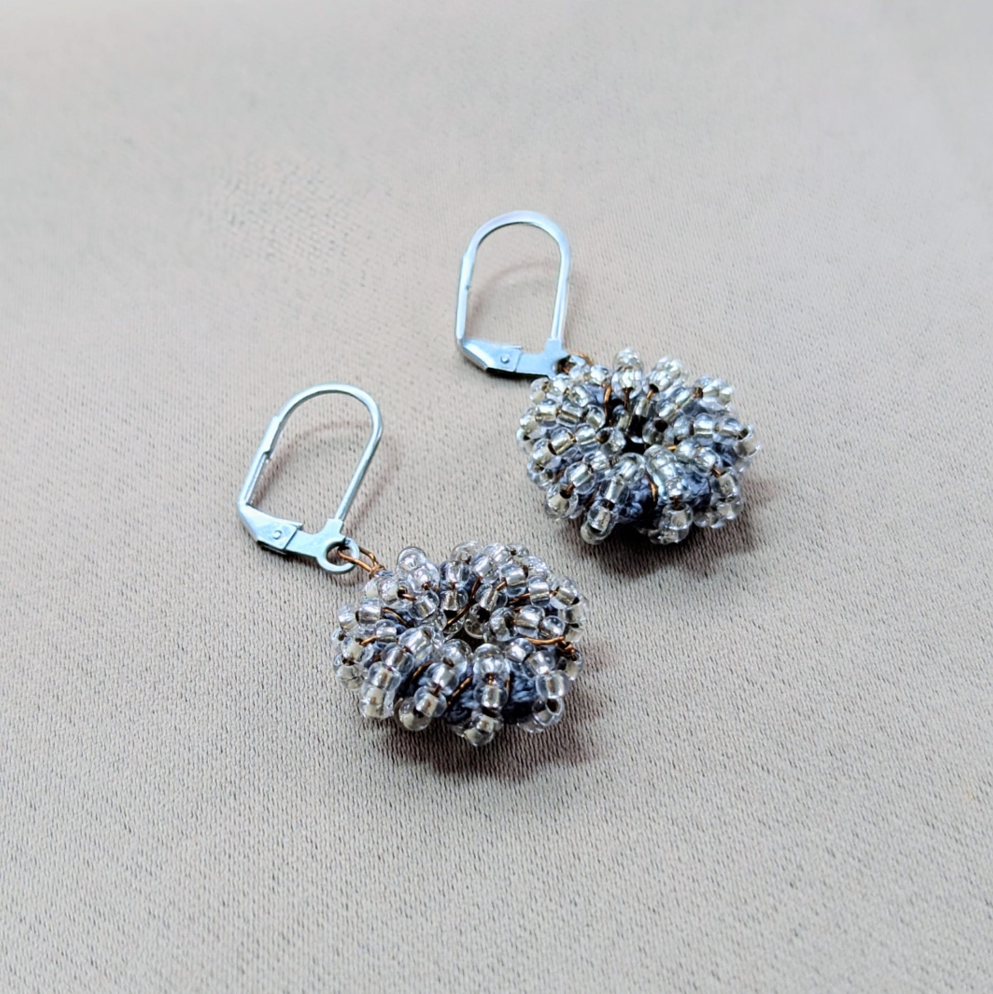 Masi Collection handmade earrings in metallic grey-blue tones.
