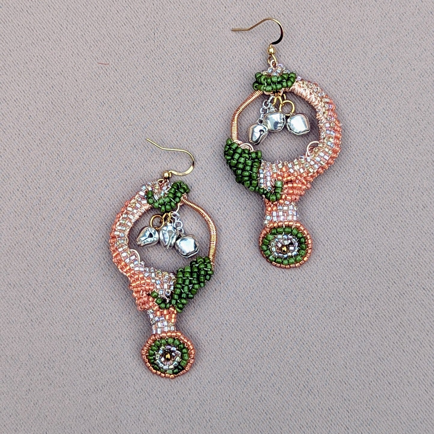 Artisan-crafted Lakshmi earrings made with Miyuki seed beads, rose-gold wire wrapping, and hypoallergenic gold-plated hooks, shown against a neutral background.