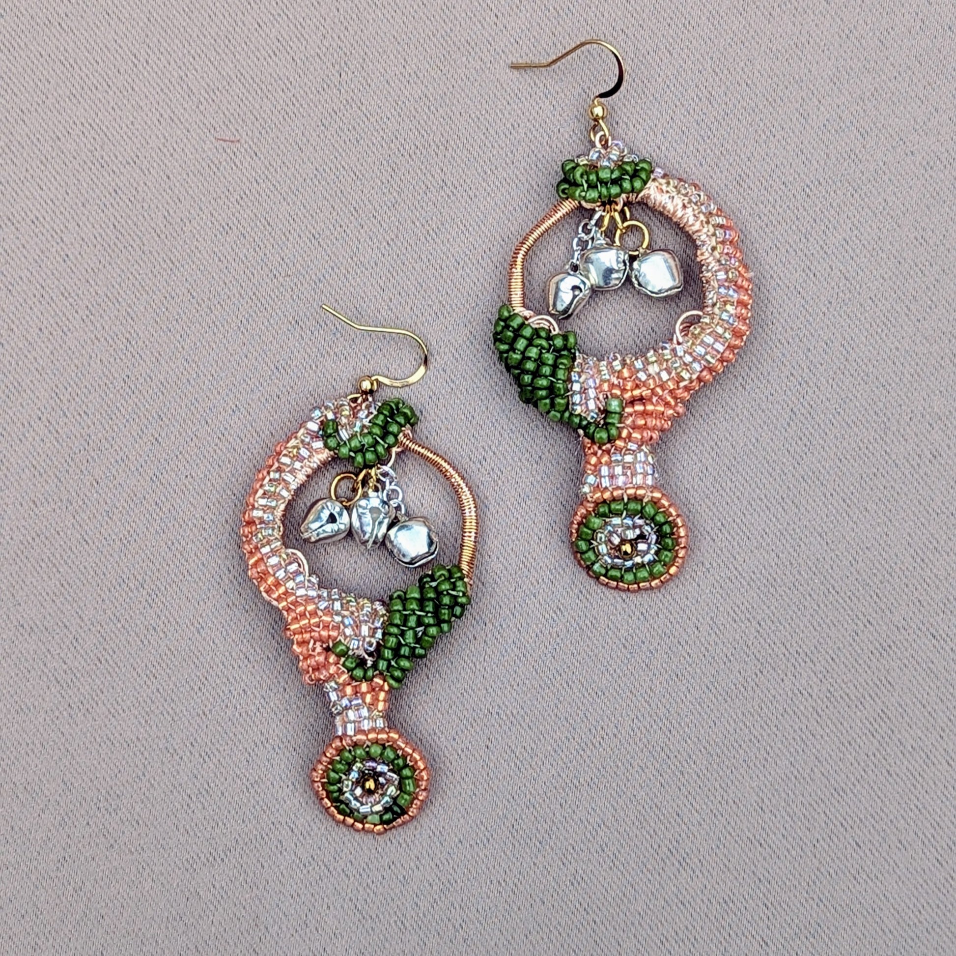 Artisan-crafted Lakshmi earrings made with Miyuki seed beads, rose-gold wire wrapping, and hypoallergenic gold-plated hooks, shown against a neutral background.