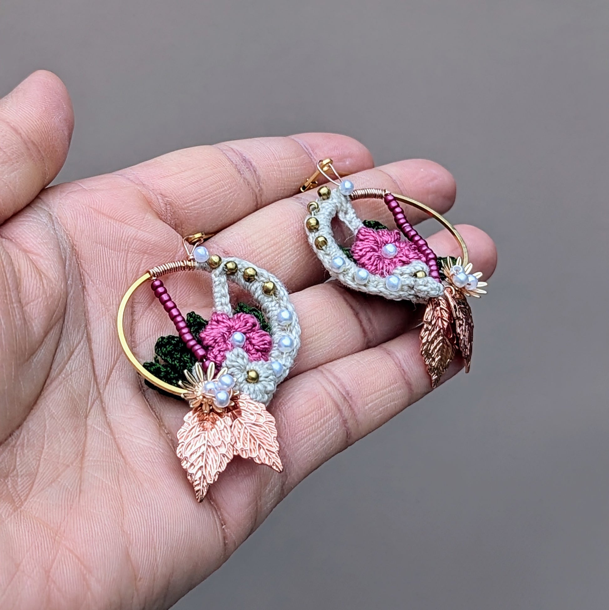 Lightweight pink and gold floral beaded hoop earrings inspired by Indian heritage and handcrafted for weddings and everyday.