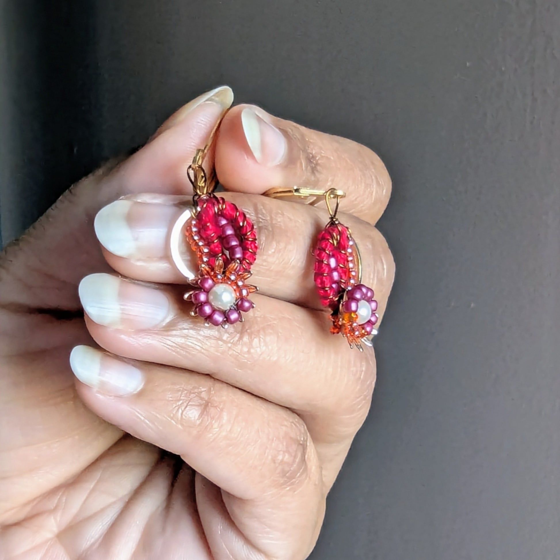 Lightweight red beaded Indian earrings handcrafted with wire-wrapped crochet detailing.