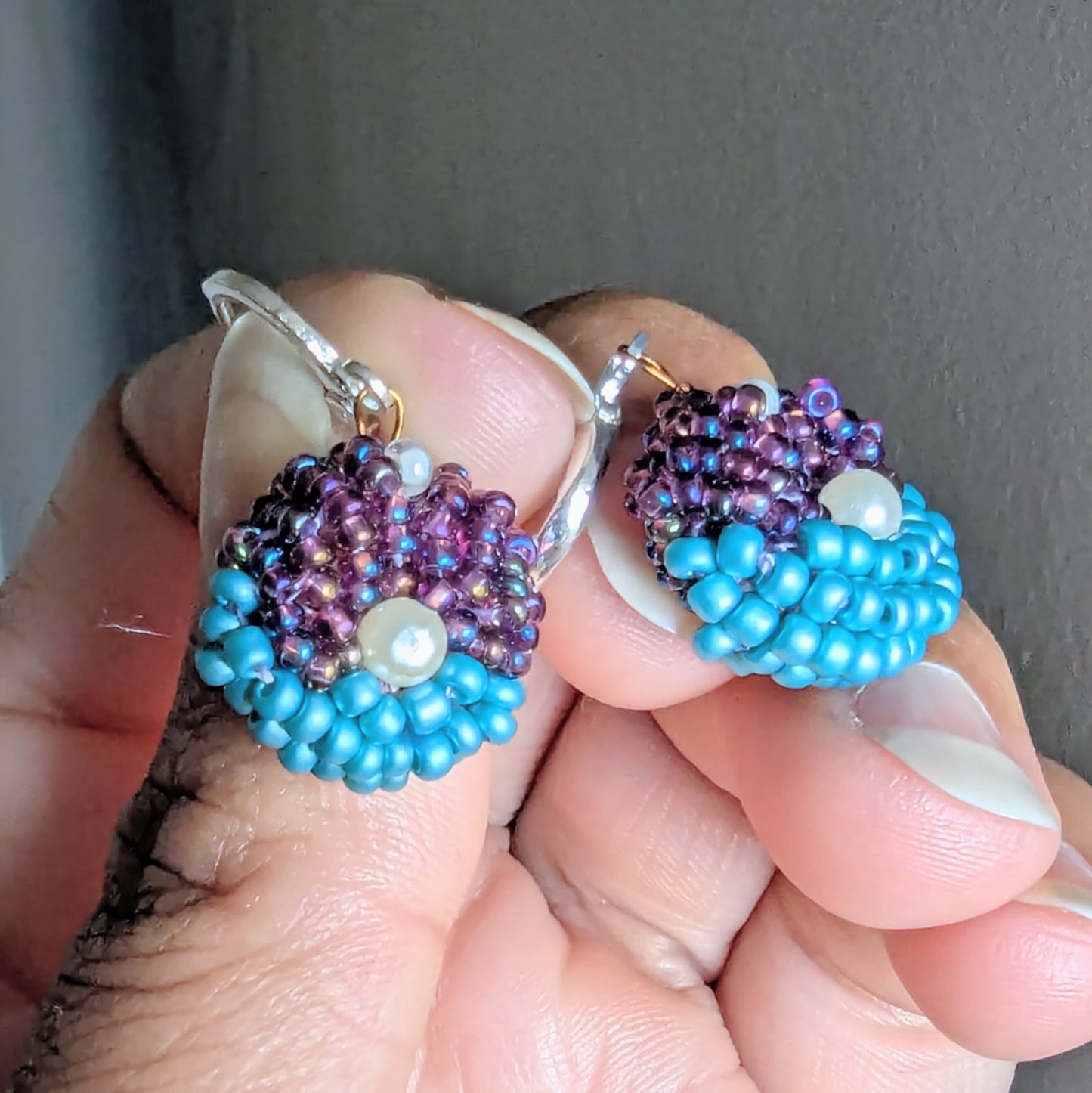 Masi Lavanya earrings in hand showing Egyptian cotton threadwork and sustainable design details