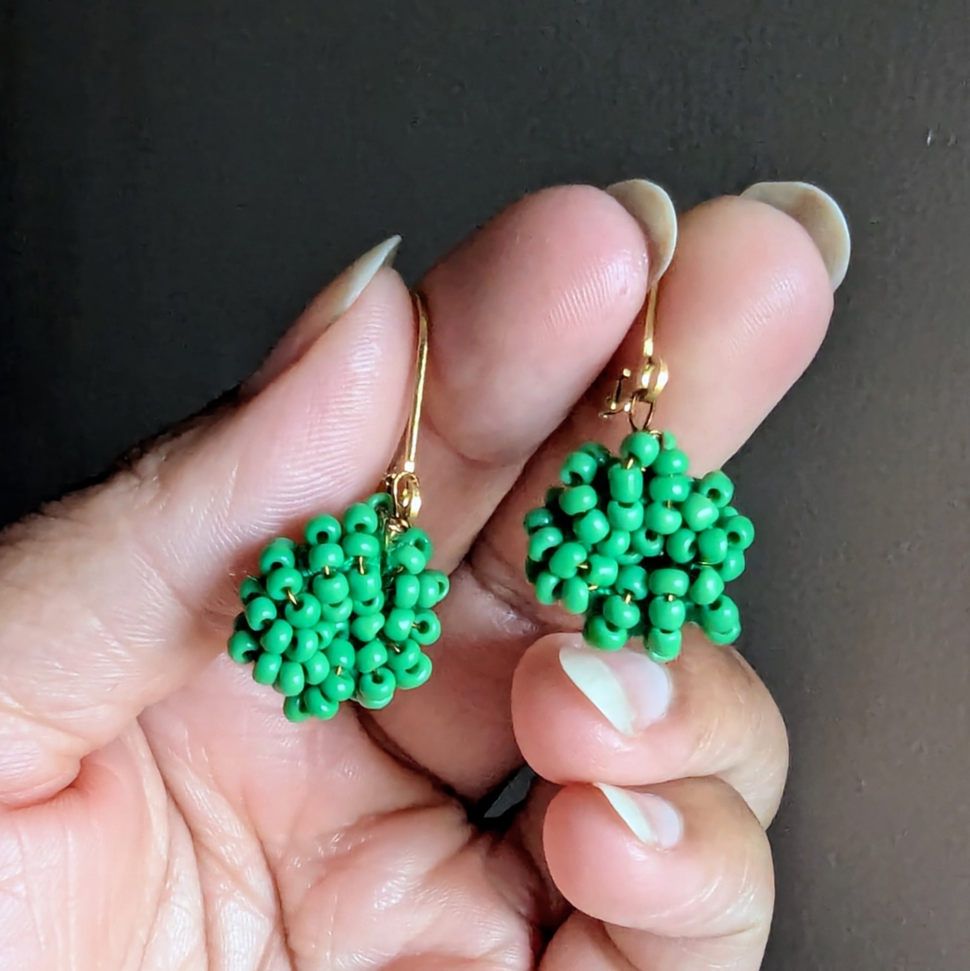 One-of-a-kind green beaded earrings inspired by family and heritage.
