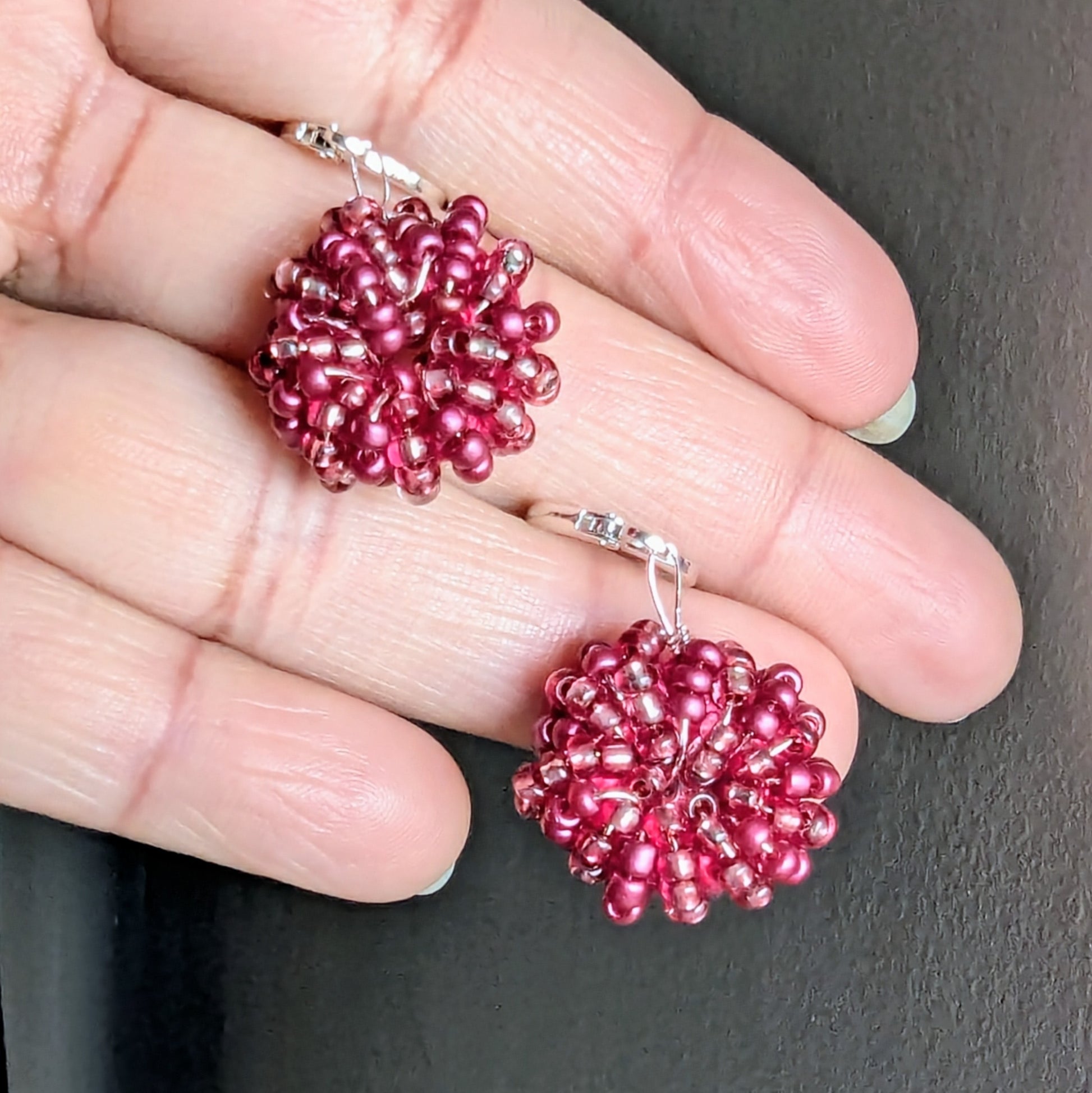 Handwoven berry pink seed bead earrings with sterling silver hooks, handmade in the UK.