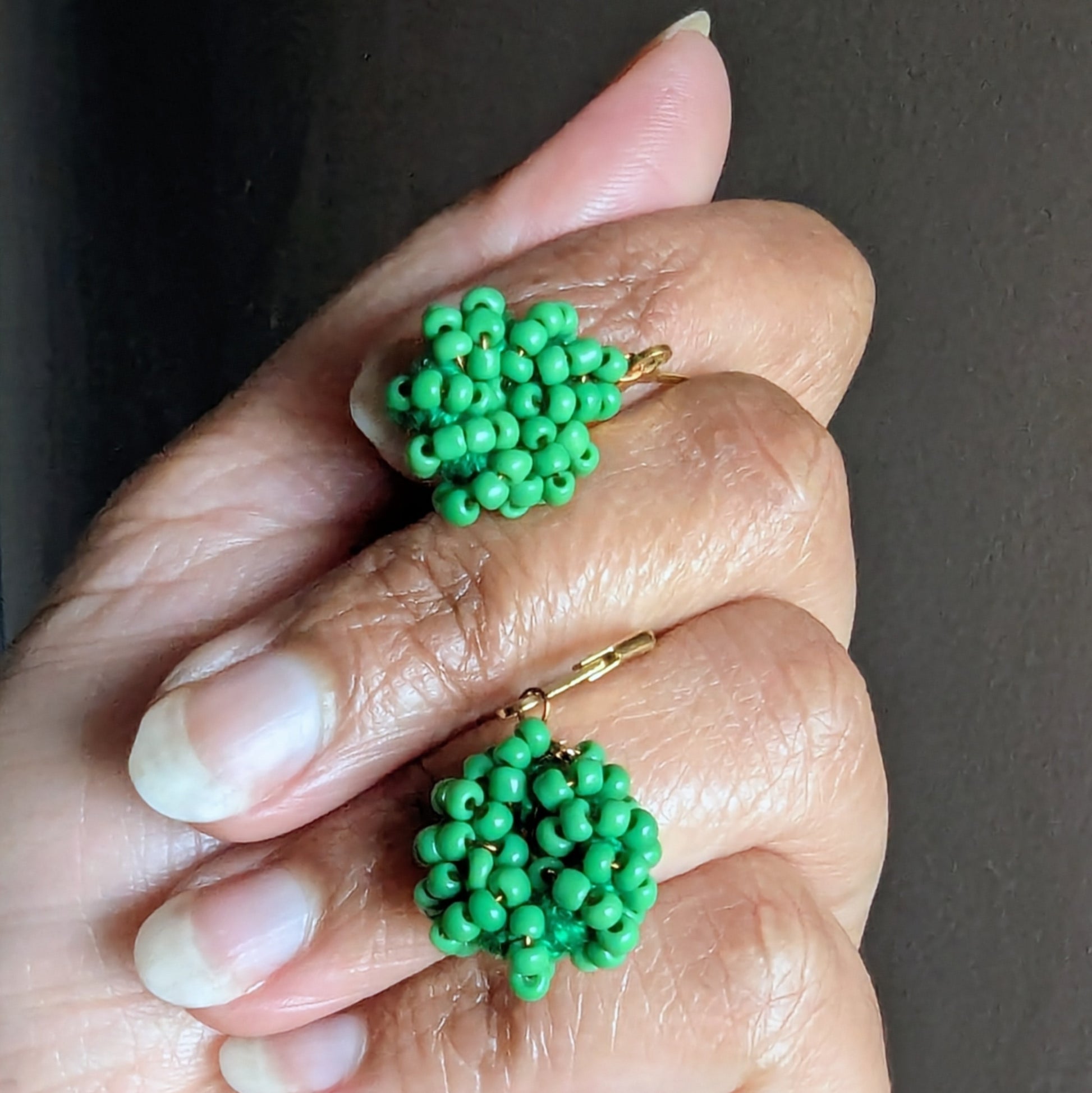 Elegant handmade light green earrings with antique bronze wire and stainless steel hooks.