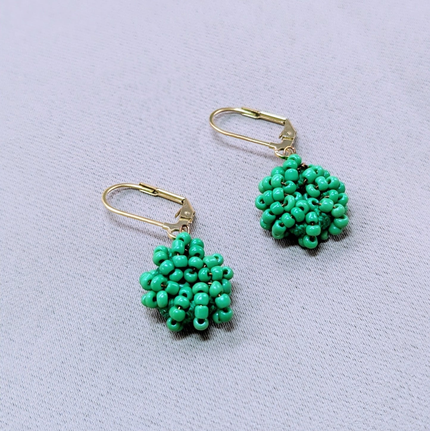 Sustainable beaded earrings symbolising new beginnings and gentle joy.