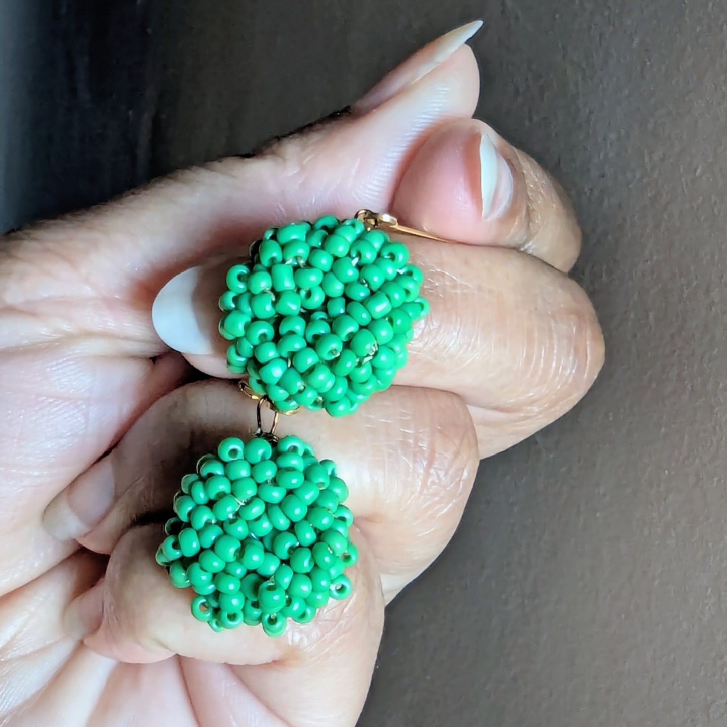 Masi Harita earrings resting on hand symbolising vitality, comfort, and everyday elegance.