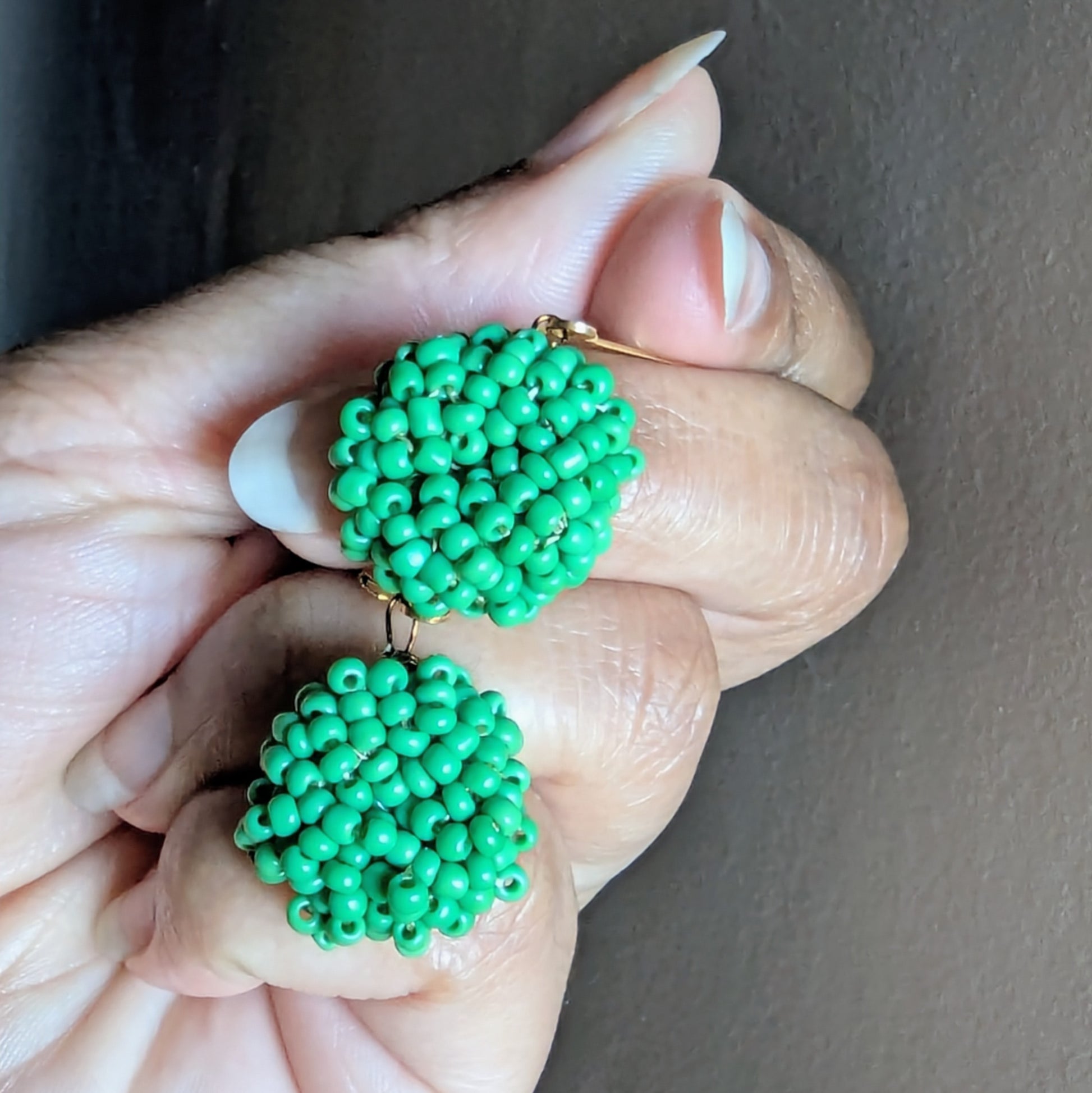 Masi Harita earrings resting on hand symbolising vitality, comfort, and everyday elegance.