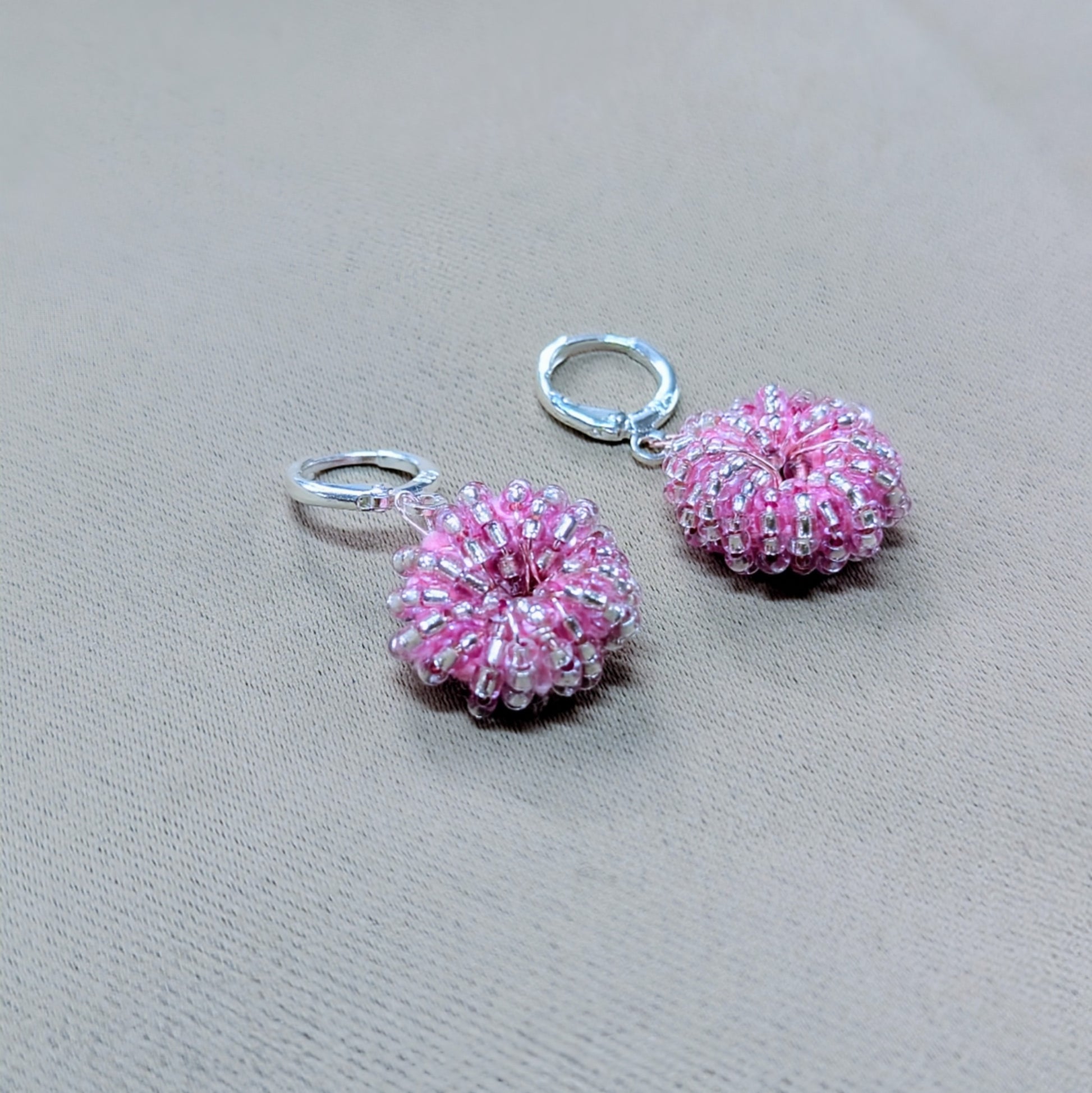 One-of-a-kind pink and silver beaded earrings inspired by family and feminine joy.