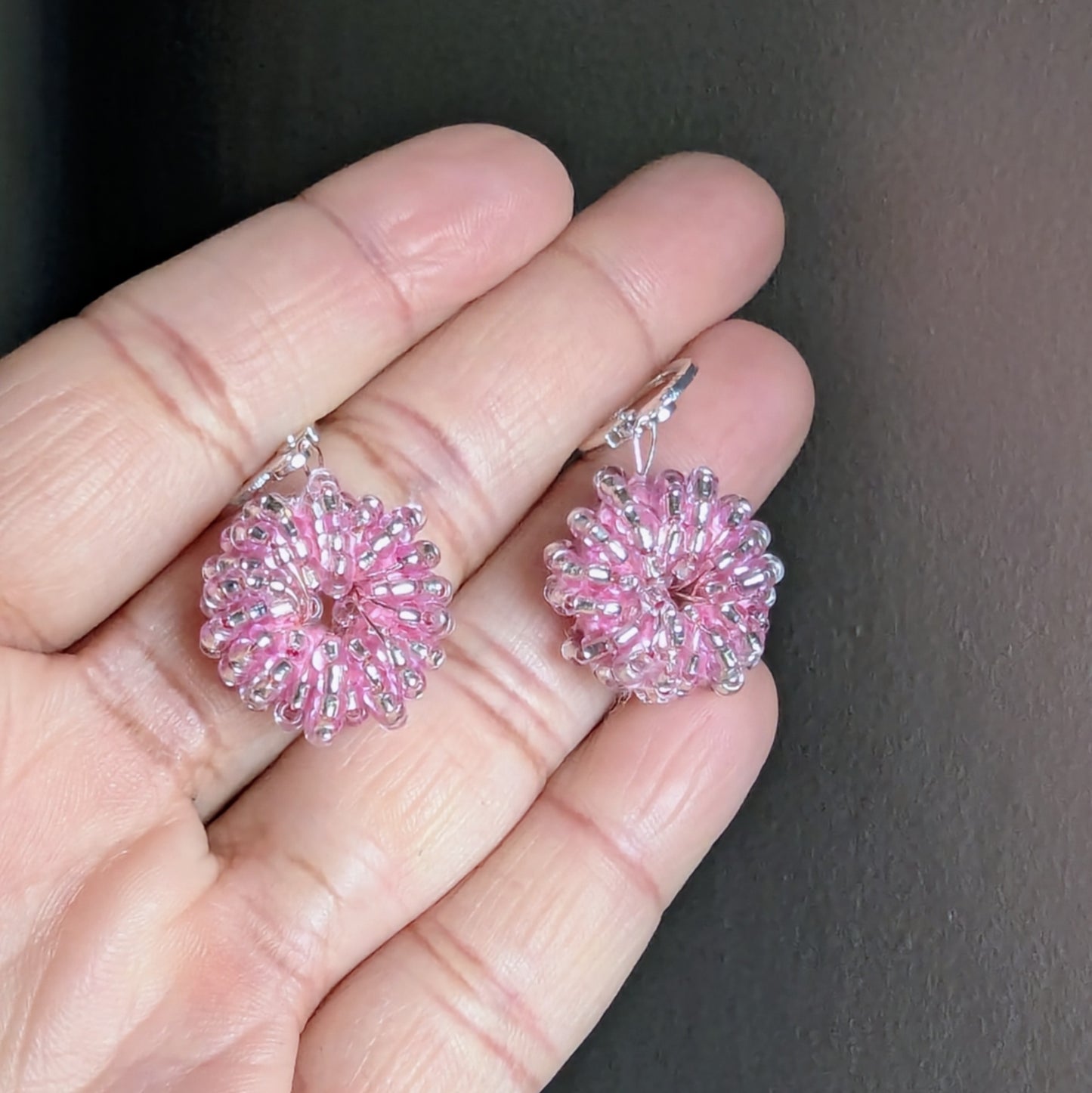 Elegant handmade pink earrings with rose gold-plated wire and sterling-silver hooks.