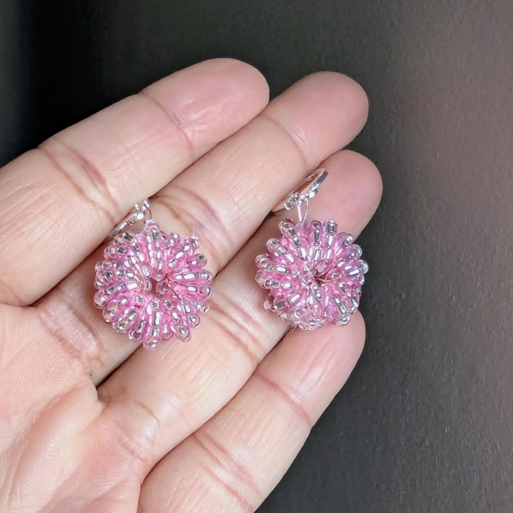 Elegant handmade pink earrings with rose gold-plated wire and sterling-silver hooks.