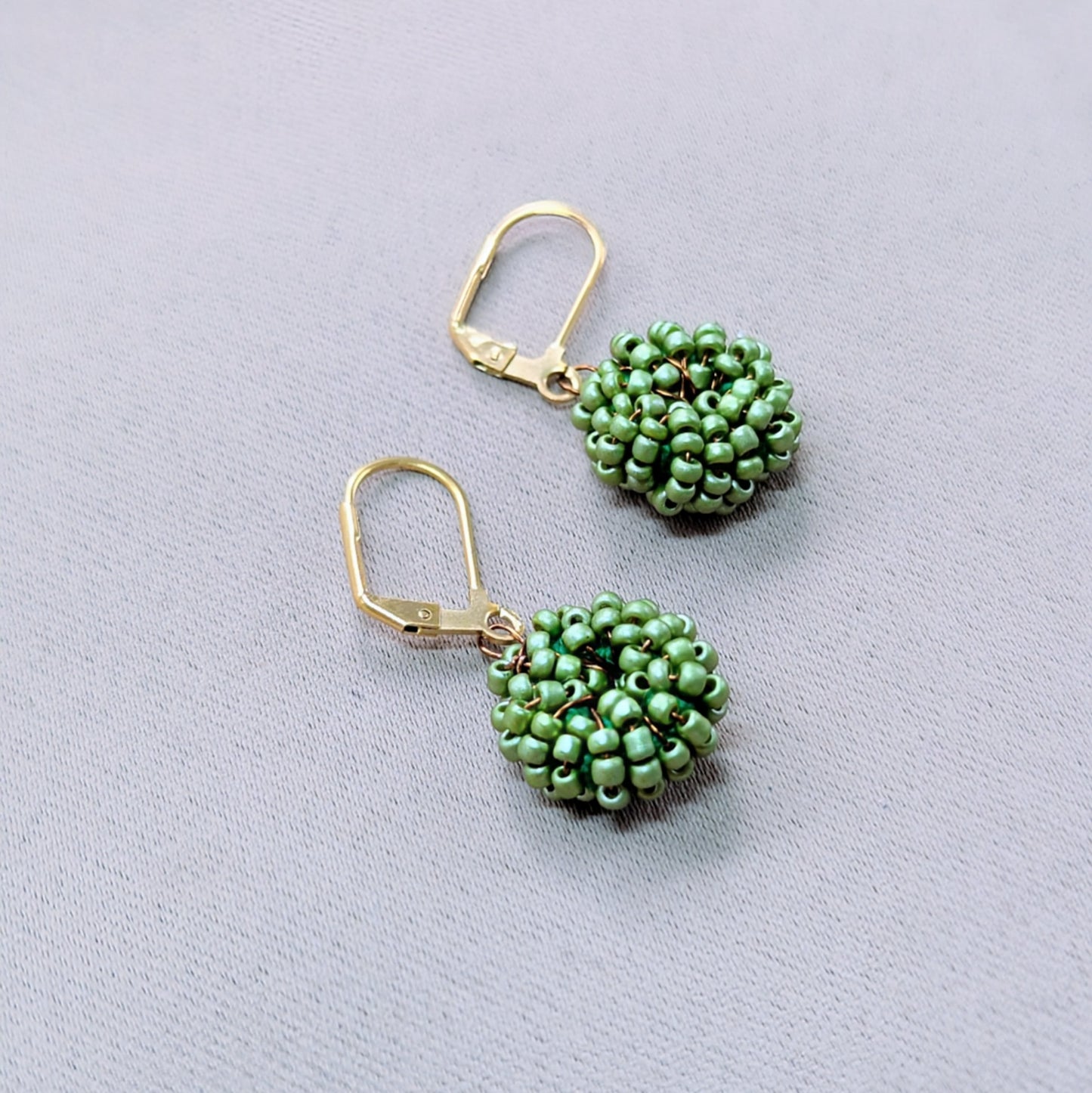 Masi Soft Green handmade earrings featuring bronze wire and Egyptian cotton crochet.