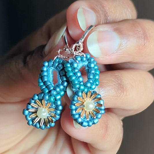 Tara blue and gold handcrafted earrings inspired by shooting stars, made by Megha of Mayaani Jewellery UK.