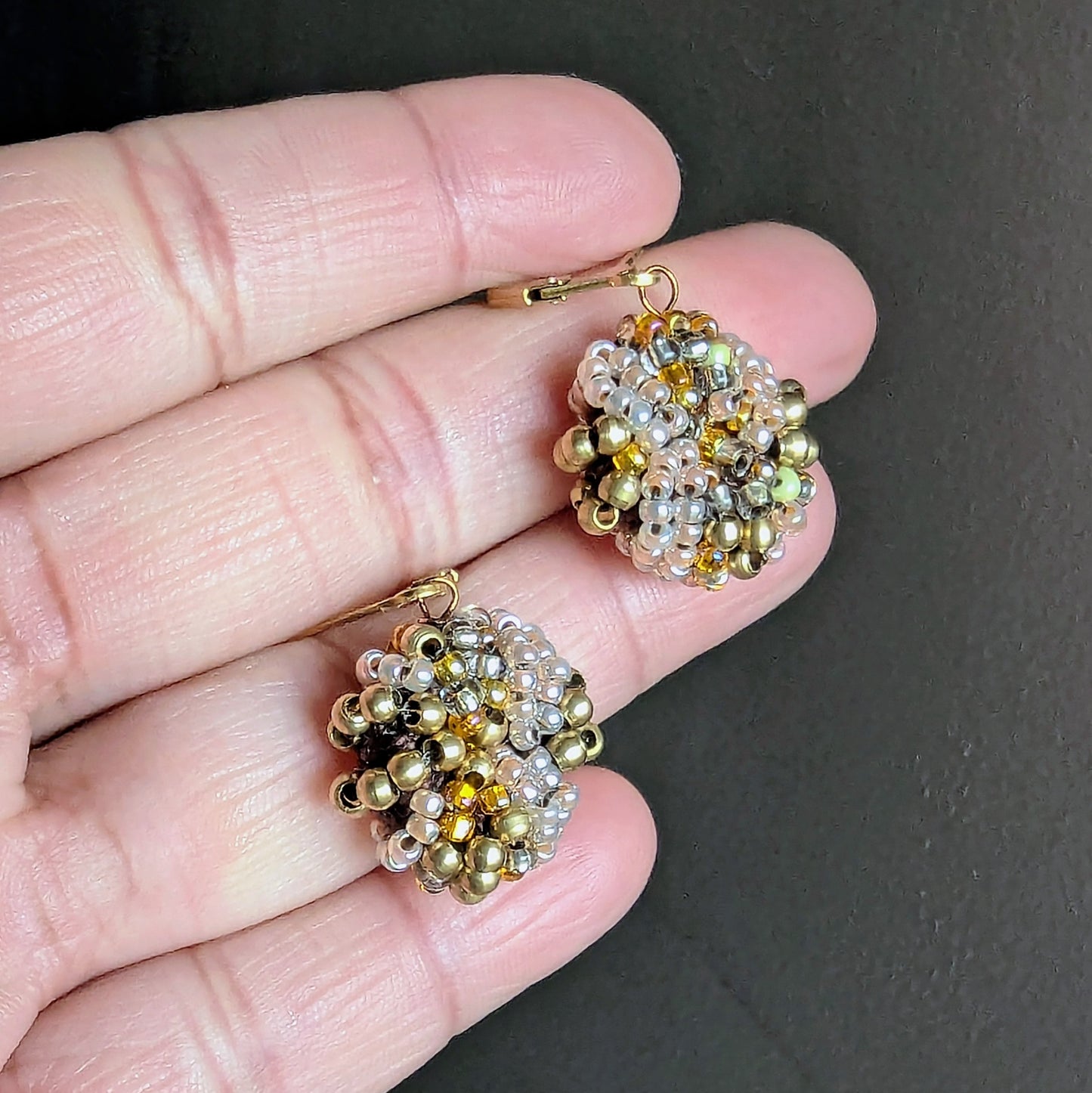 Sustainable handmade earrings in radiant brass and gold tones.