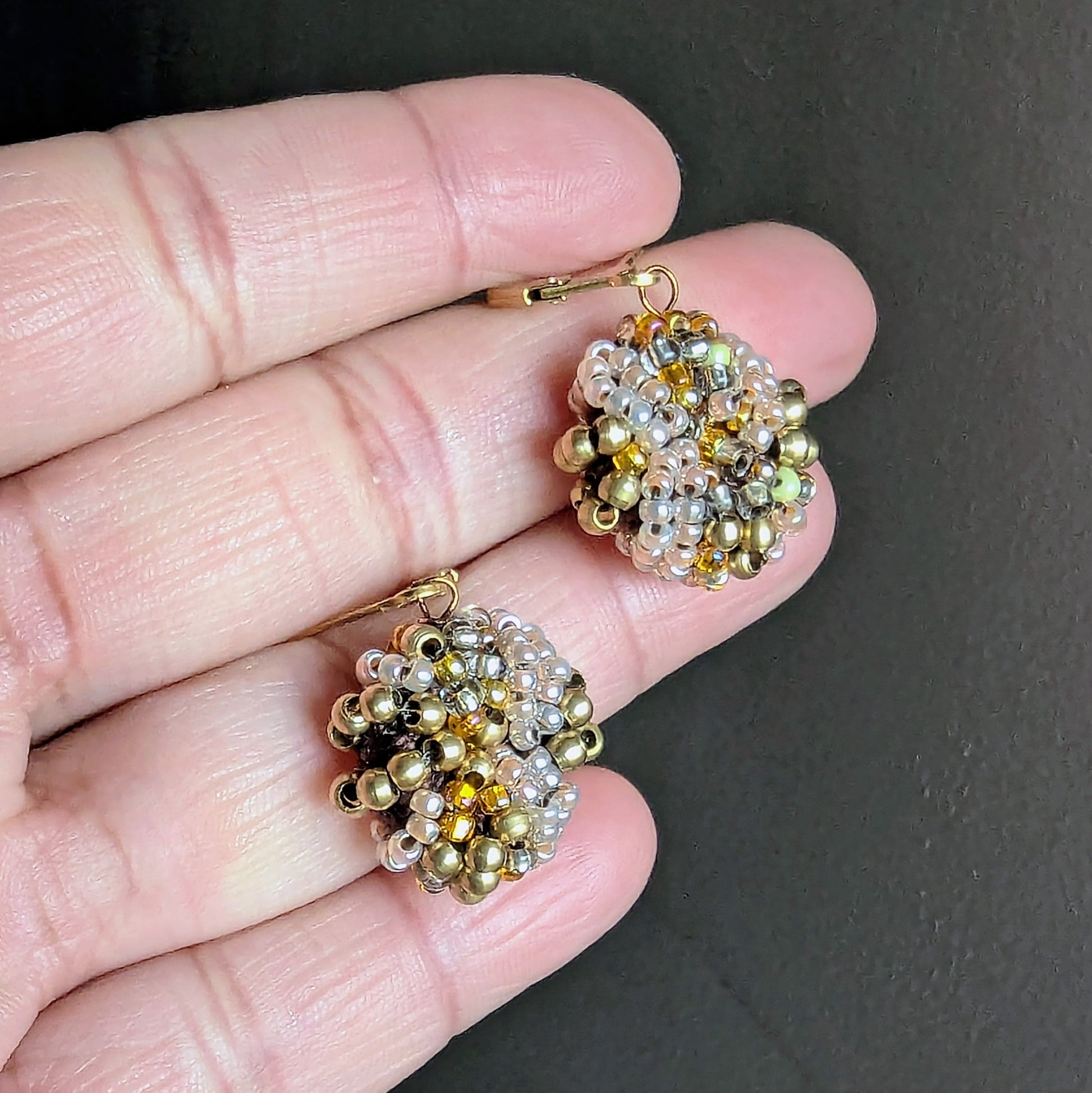 Sustainable handmade earrings in radiant brass and gold tones.