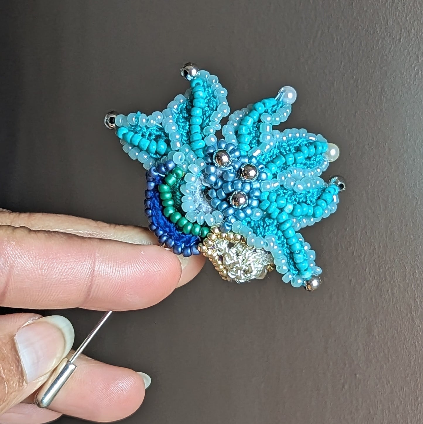 Jalika one of a kind turquoise textile brooch featuring reclaimed vintage seed beads, pearl details and intricate hand embroidery.