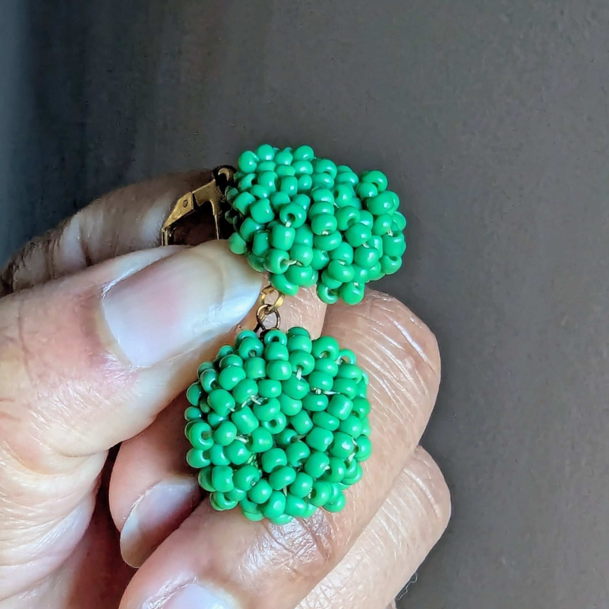 Masi Harita handcrafted green beaded earrings made with Czech glass seed beads and gold lever-back clasps by Megha of Mayaani Jewellery UK.