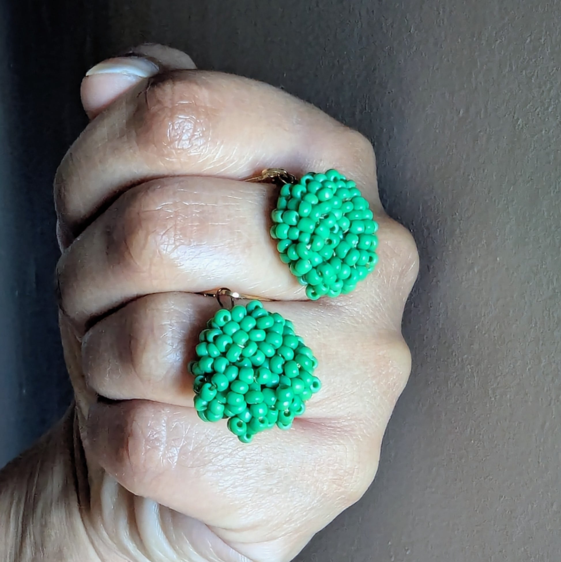 Pair of vibrant Masi Harita earrings representing renewal and mindful luxury in wearable form.