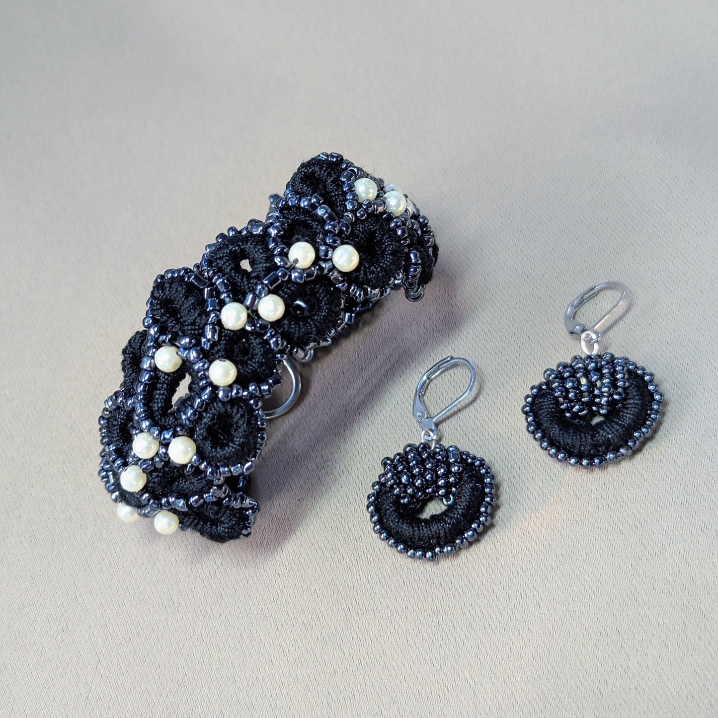 Handcrafted black crochet bracelet and matching beaded earrings set with vintage pearls from Mayaani Jewellery.