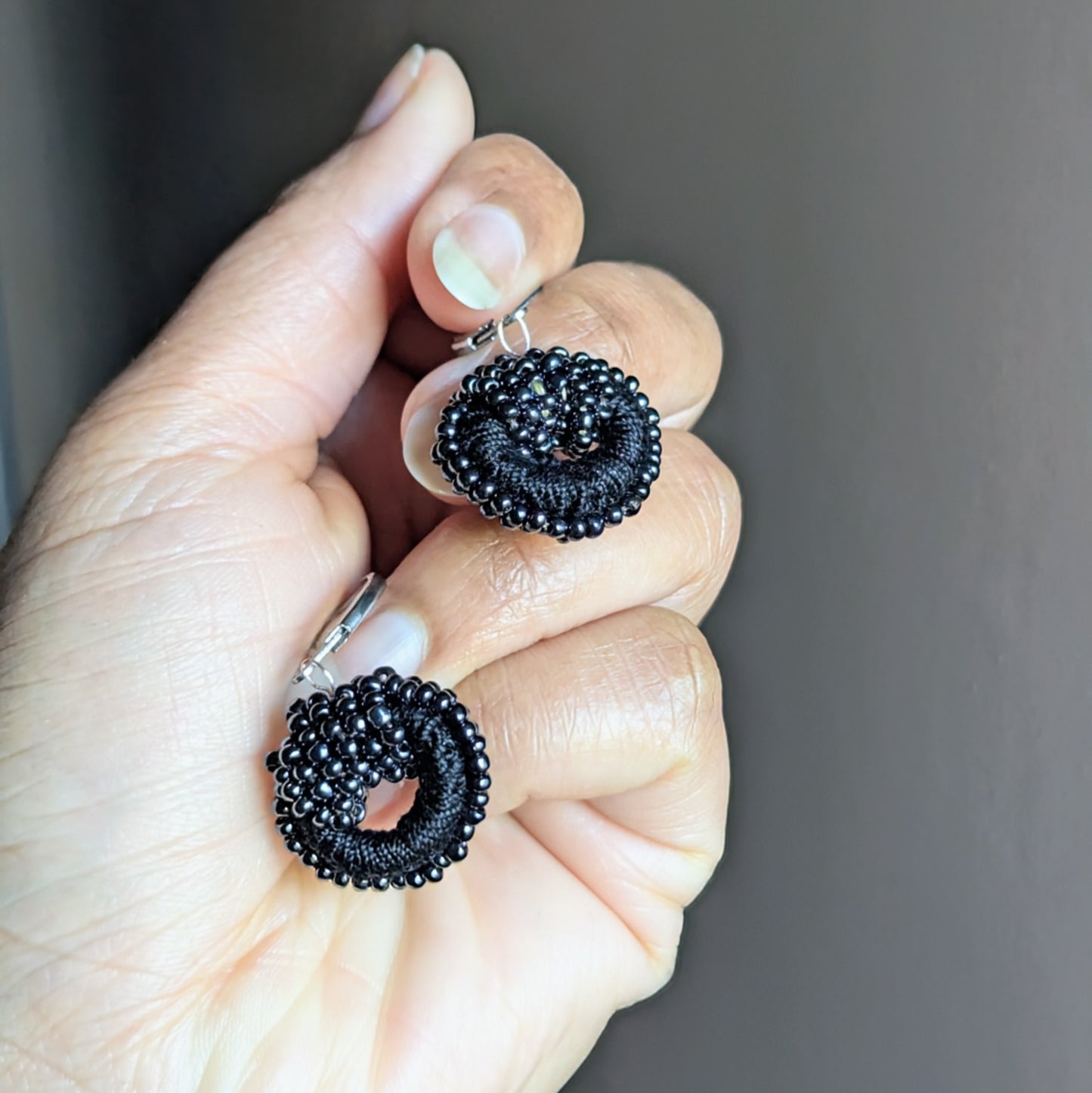 Nisha black crochet earrings featuring upcycled glass beads and rose gold wire work