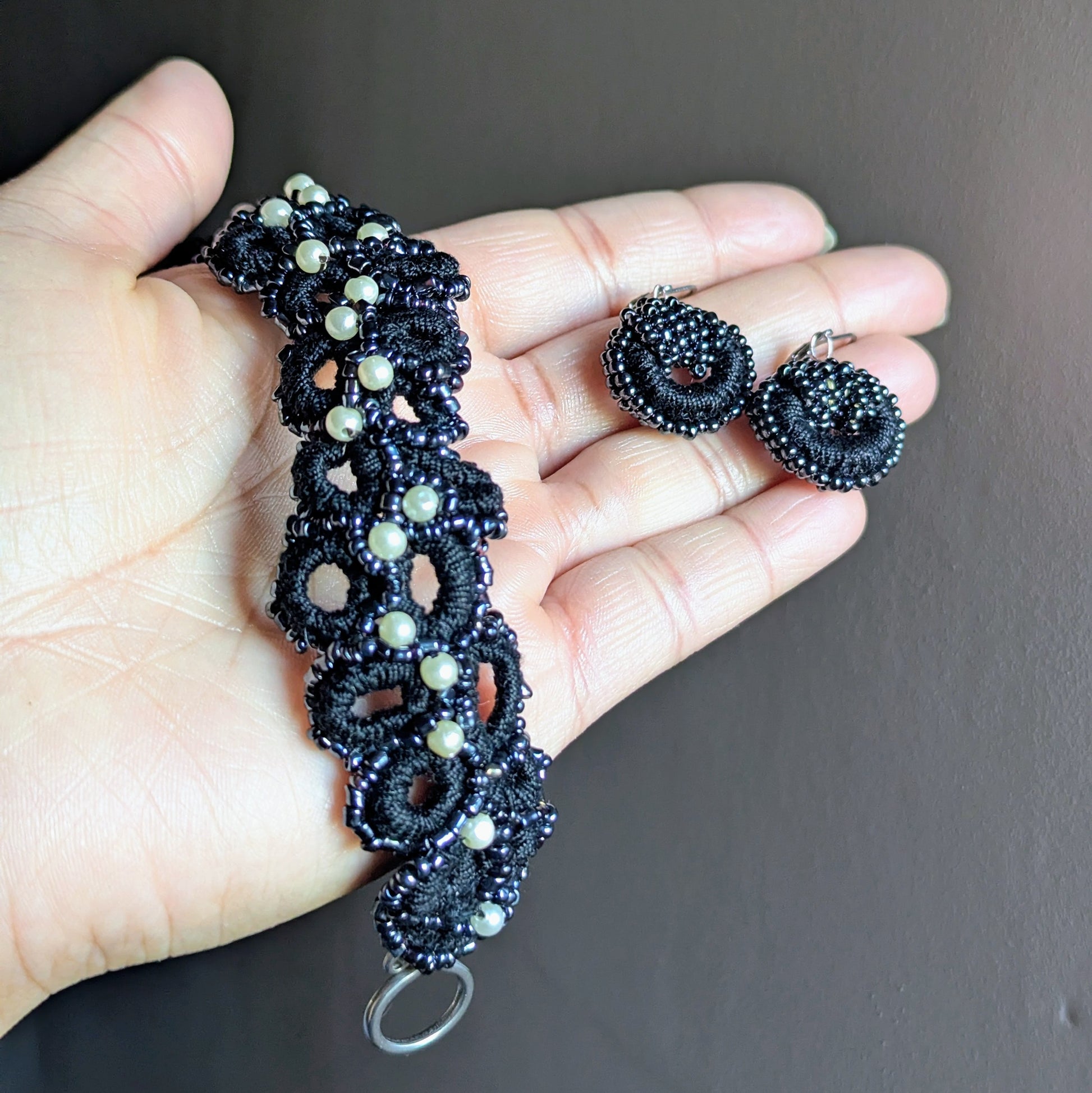 Nisha black pearl bracelet and earring set, handmade in the UK using crochet, seed beads, and stainless steel.