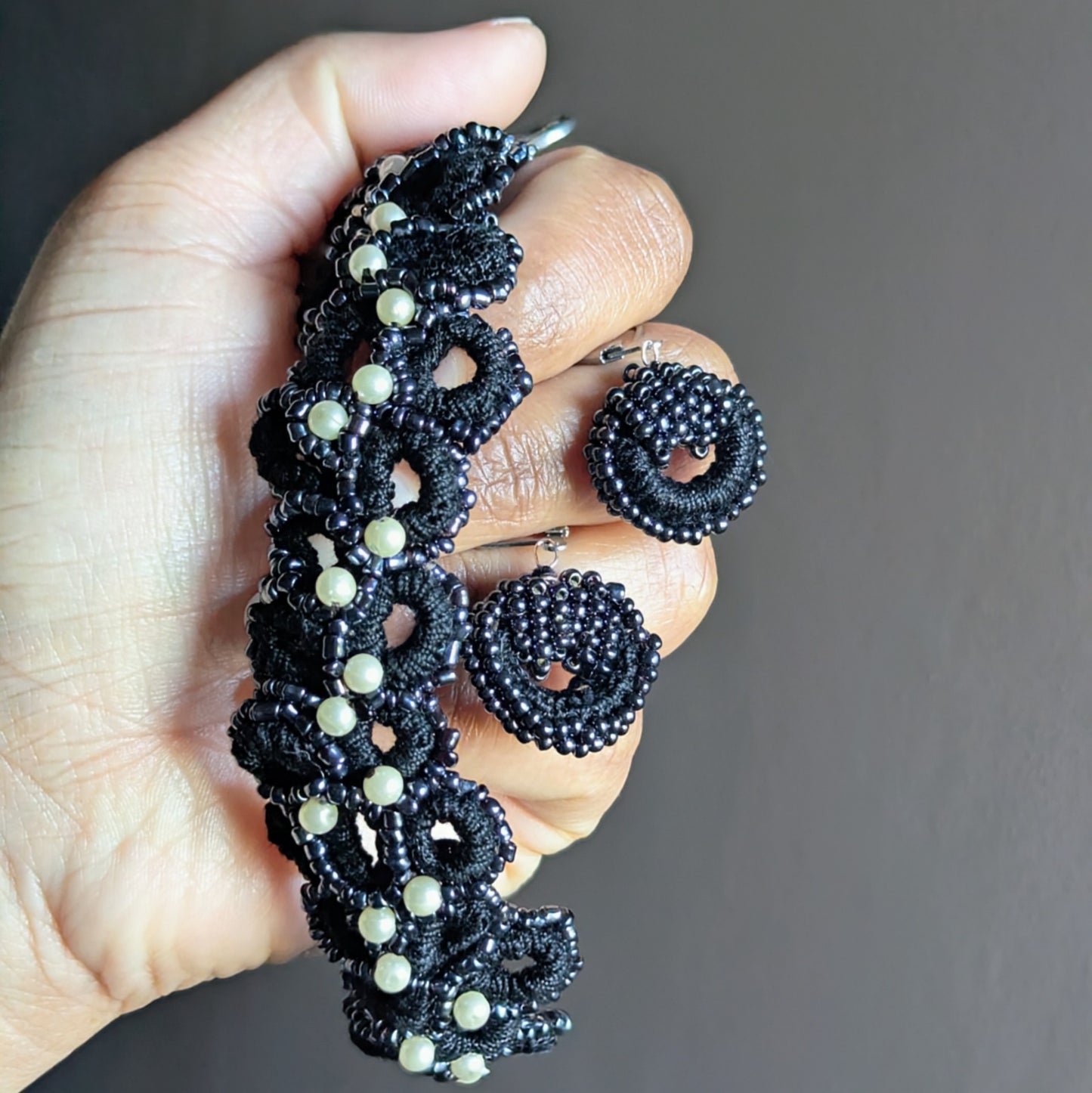 Black and silver beaded bracelet with matching earrings, lightweight and hypoallergenic artisan design.